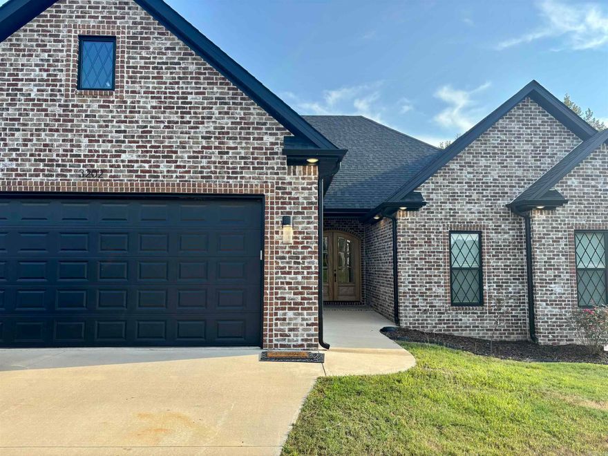 Introducing 3202 Fairview Rd in Paragould, a home that perfectly blends sophistication and comfort. Set on a spacious .46-acre lot, this residence offers 3 bedrooms, 2 bathrooms, and 2,130 sq ft of thoughtfully designed living space. You'll love walking through the 8-foot double wood doors into the bright, open floor plan. The living room features a cozy fireplace with a hand-cut mantle, perfect for relaxing evenings. The kitchen is ready for all your cooking and entertaining needs with Samsung appliances and gorgeous white quartz countertops. With luxury vinyl plank flooring throughout, the home is as stylish as it is durable. The oversized master suite has a huge walk-in closet plus a makeup vanity, while the bathroom feels like a spa with granite countertops, a freestanding tub, and a custom shower with glass walls. The guest bedrooms all have walk-in closets, and the garage was built with extra space for larger vehiclesplus it comes with a heated and cooled storage room. The big backyard is perfect for kids, pets, or hosting family get-togethers. This home truly has something for everyonecome see it before it's gone!