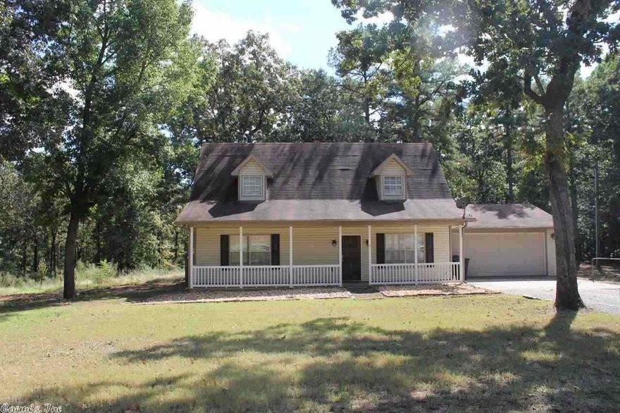 Country Setting with a Full Front Porch is what I call a Happy Place!! Make this Four Bedroom Two Bath Your Home Today! Large Living Area ~ Eat in Kitchen with Breakfast Bar ~ Tons of Storage Available in the Beautiful Oak Cabinets ~ Pantry and Dining Area. Two Large Bedrooms Upstairs and Two Down. Fenced Yard with plenty of Mature Tree's for Shade. Freshly Painted Rooms~ New Countertop Backsplash and Appliances.