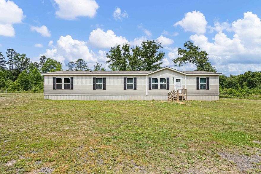 Beautiful 4-bedroom, 2-bath home offering 2,432 sq ft of living space on 10.82 peaceful acres with privacy, wildlife, and room to enjoy country living at its best. This spacious home features walk-in closets, a large dining area, split living room, extra den, very large laundry room, and handicap accessibility. The open layout is perfect for entertaining and hosting large family gatherings and holidays. Step outside to enjoy the covered back porch where you can relax and watch the abundant wildlife, including deer that frequent the property year after year. The above-ground pool provides the perfect summer hangout, while the artesian well is an added bonus for outdoor use and the duck pond. Kids will love the wide-open space to run and play. The property borders Rose Creek, giving you access to fishing, playing in the water, and even searching for arrowheads. Additional features include a storage building with electric and workbench, another storage shed, and beautiful natural surroundings. Conveniently located near outdoor recreation with Petit Jean State Park only about 10–15 minutes away for hiking and family adventures. The Petit Jean River at Pontoon is nearby.