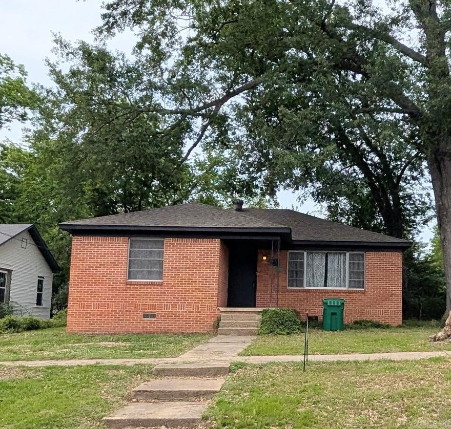 One block from Downtown Benton. Walk to all of the new local restaurants and shopping centers. Hardwood floors. New roof in 2018. New Vinyl plank flooring in kitchen, bathroom and laundry room. Several new lights. New toilets, New tankless water heater, new countertops and kitchen sink. 1 minute from the interstate. Surrounded by commercial properties. Rented for the past 14 years. Broker owned. Excellent location. Carport behind house. Call Showtime for appointment.