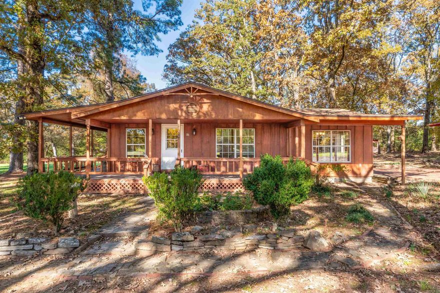 This 20-acre property includes 16 acres of pasture and 4 acres of woods, with two seasonal creeks and two ponds, one stocked with fish. Well-maintained pastures, existing fencing, and open space make it ideal for horses or other livestock. Perfect for a homestead or small farm. It includes a variety of trees, including crape myrtles, oaks, maples, pines, and fruit trees such as peach, pear, and plum. The 1,520 sq. ft. home features 2 bedrooms and 2 bathrooms with vaulted ceilings, original wood floors and solid construction throughout. A large covered porch wraps around two sides of the home, and windows throughout offer peaceful views. The kitchen showcases handmade custom cabinetry and a classic propane gas range. All appliances convey. Outbuildings include a hay/pole barn with a metal roof, a fully enclosed large shop, a garden shed, and a carport for three vehicles. Conveniently located in the Greenbrier School District, the property is just 5 minutes to Wooster, 10 minutes to Greenbrier, 20 minutes to Conway, 40 minutes to Little Rock and 35 minutes to the Ozark foothills. A rare opportunity to purchase unrestricted land and a charming home in a sought-after location.