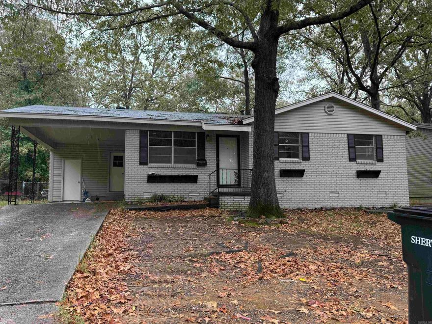 Updated 3 bedroom/1.5 bath home in the heart of Sherwood! This home sits in a wonderful, established neighborhood close to everything. French doors lead out from the kitchen/breakfast are to a HUGE but cozy bonus living area with exposed brick and a rock fireplace. You will love the heated and cooled "Four Seasons" porch to enjoy year round! Primary bedroom has half bath. Separate laundry and outside storage in carport. Backyard is fully fenced. No seller property disclosure.