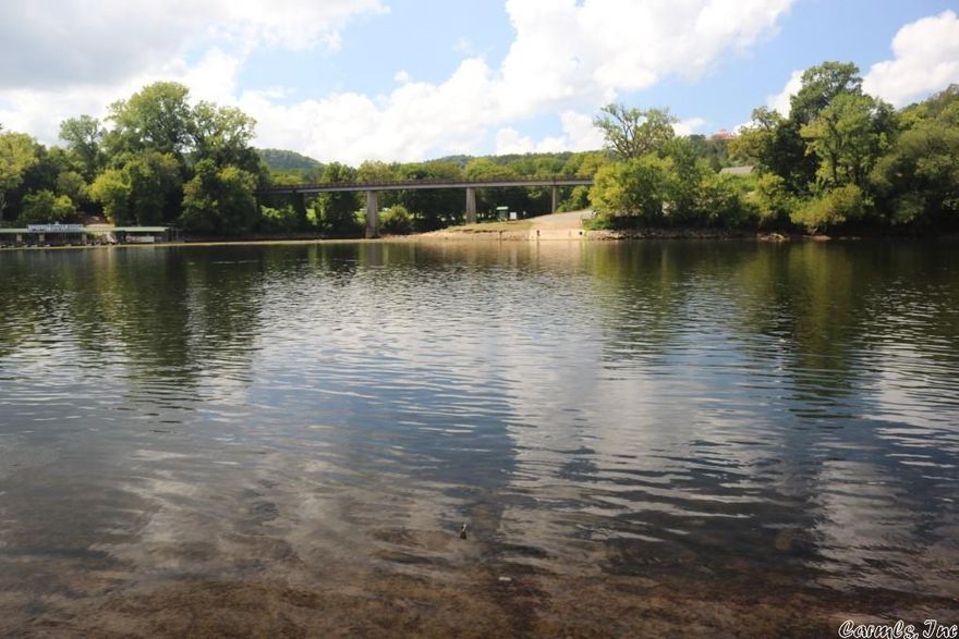 02215- The opportunities are endless with this 14 Acres. It is in a very high traffic area on the bank of the White River, home to some of the best trout fishing in the world. The property also has State Highway 9 frontage and paved county road frontage. There are no restrictions and part of the property is not in the flood plane. Great place for a new restaurant with riverfront dining, rental cabins, permanent homes, or condos. Power and water is available. $1,250,000