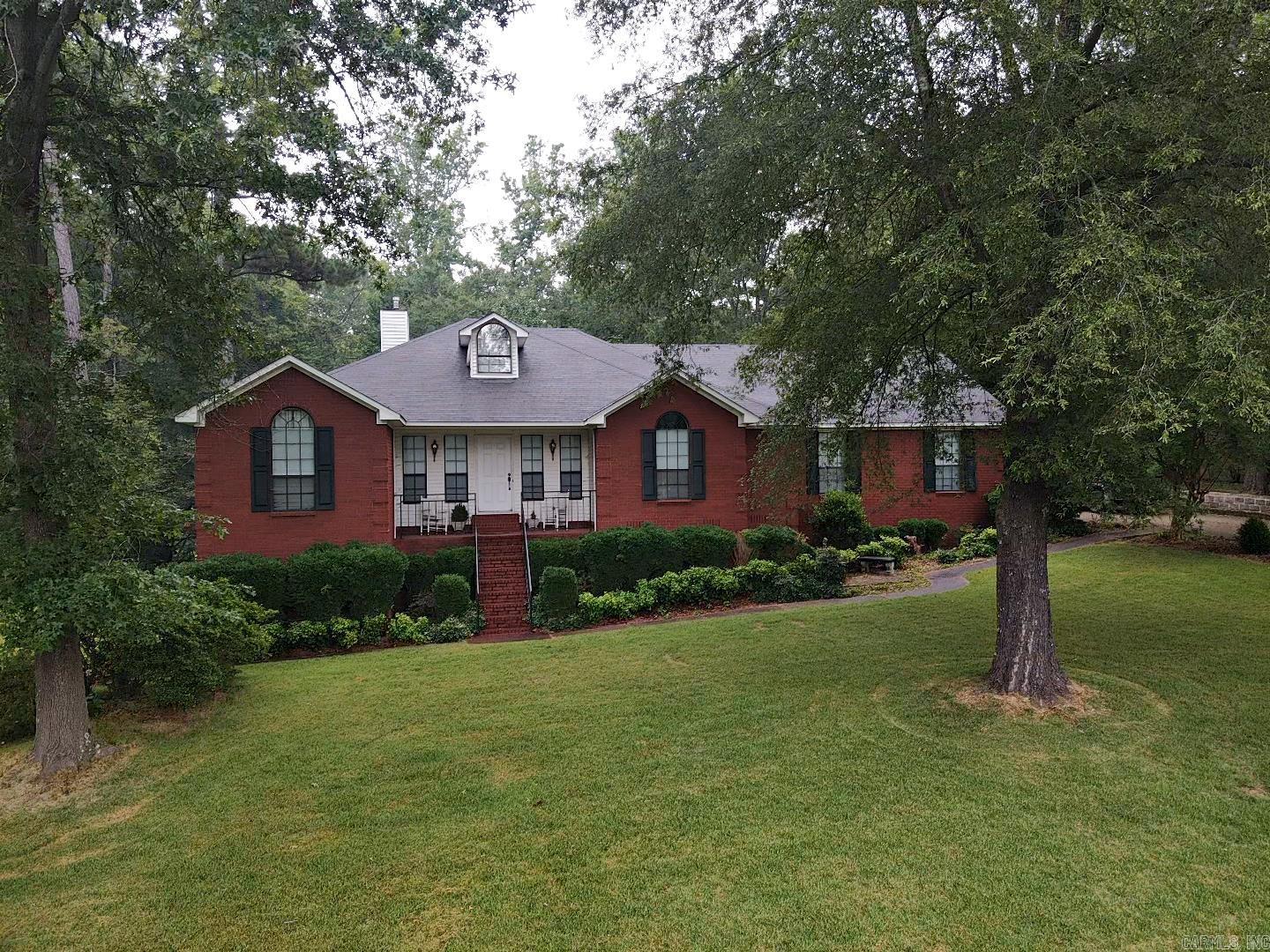 Beautiful home sitting on two corner lots surrounded by mature trees and majestic landscape. This home is so inviting both inside and out; awesome views from inside the dining, living areas or the back deck while entertaining. Split floorplan, with master suite off the kitchen and two bedrooms on the opposite side of home. One of the bedrooms has a private sunporch with access to the back deck. Gazebo overlooks the terraced flower gardens, large basement area for storage and workshop, attic space for storage or future expansion.