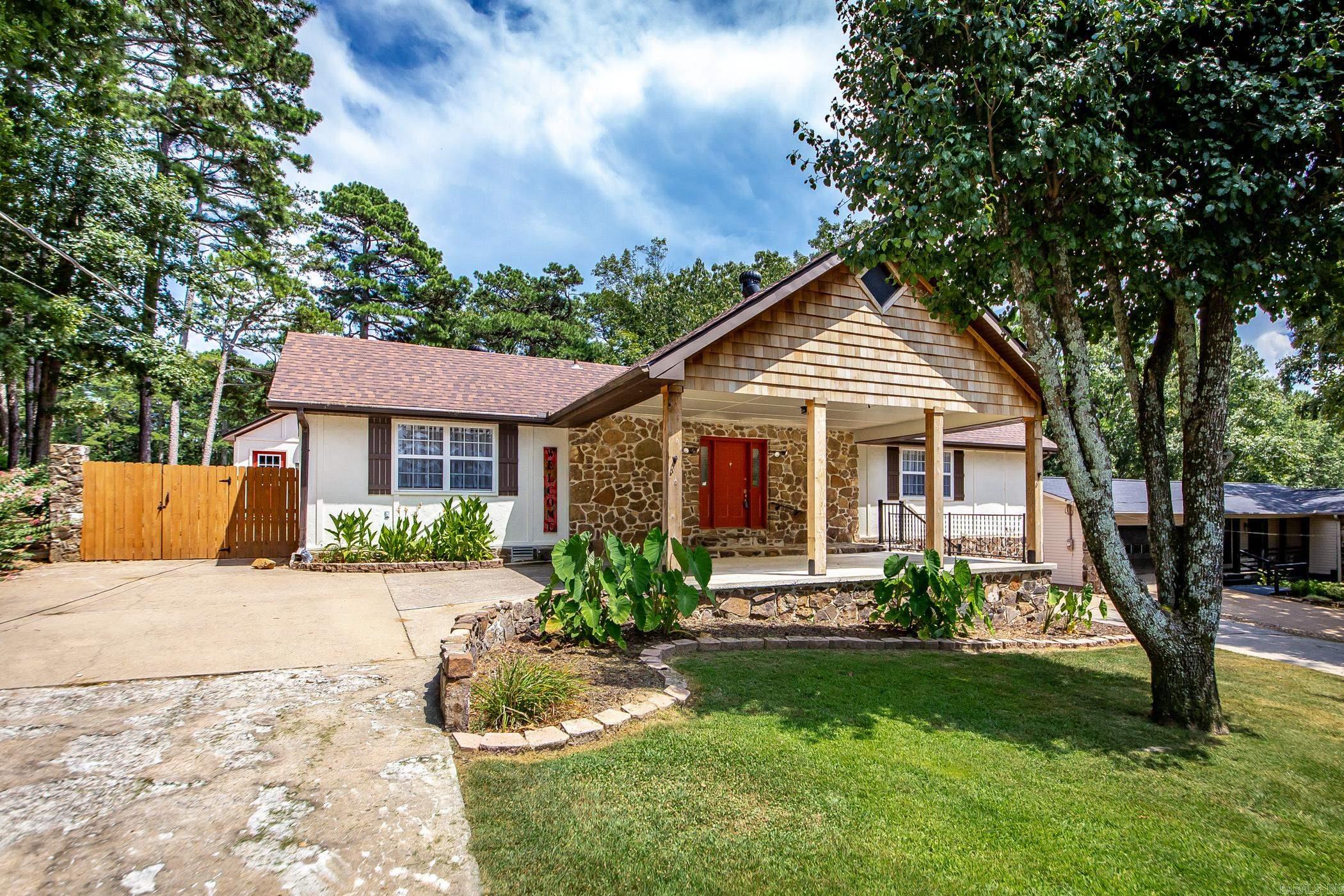 Welcome to this exquisitely remodeled home on Indian Hills Golf Course. This property promises a lifestyle of relaxation & leisure because all of the updates have been completed so you can enjoy a day on the course & sunsets on the lake. Step inside to discover a thoughtfully designed split floorplan highlighted by large windows & the spacious living room/dining area with new ventless gas logs in the fireplace. The kitchen includes a new stove & vent-a-hood. The refrigerator, washer, & dryer convey w/ the sale of this property. Immerse yourself in comfort with a suite of 2023 upgrades, such as a brand-new roof, a cutting-edge mini-split hvac unit, & a high-efficiency HVAC unit, newly installed windows & elegant french doors, & many other updates including painting inside & out. Fairfield Bay comes with unmatched amenities, including access to 3 sparkling swimming pools, vibrant playgrounds, well-maintained tennis courts, modern fitness center, hiking & biking trails, ATV/UTV trails, pickle ball, 2-18 hole golf courses, bowling alley & pristine Greers Ferry Lake. There is a lower level area workshop/storage & the golf cart garage/storage building. Come enjoy the life. New sewer pump