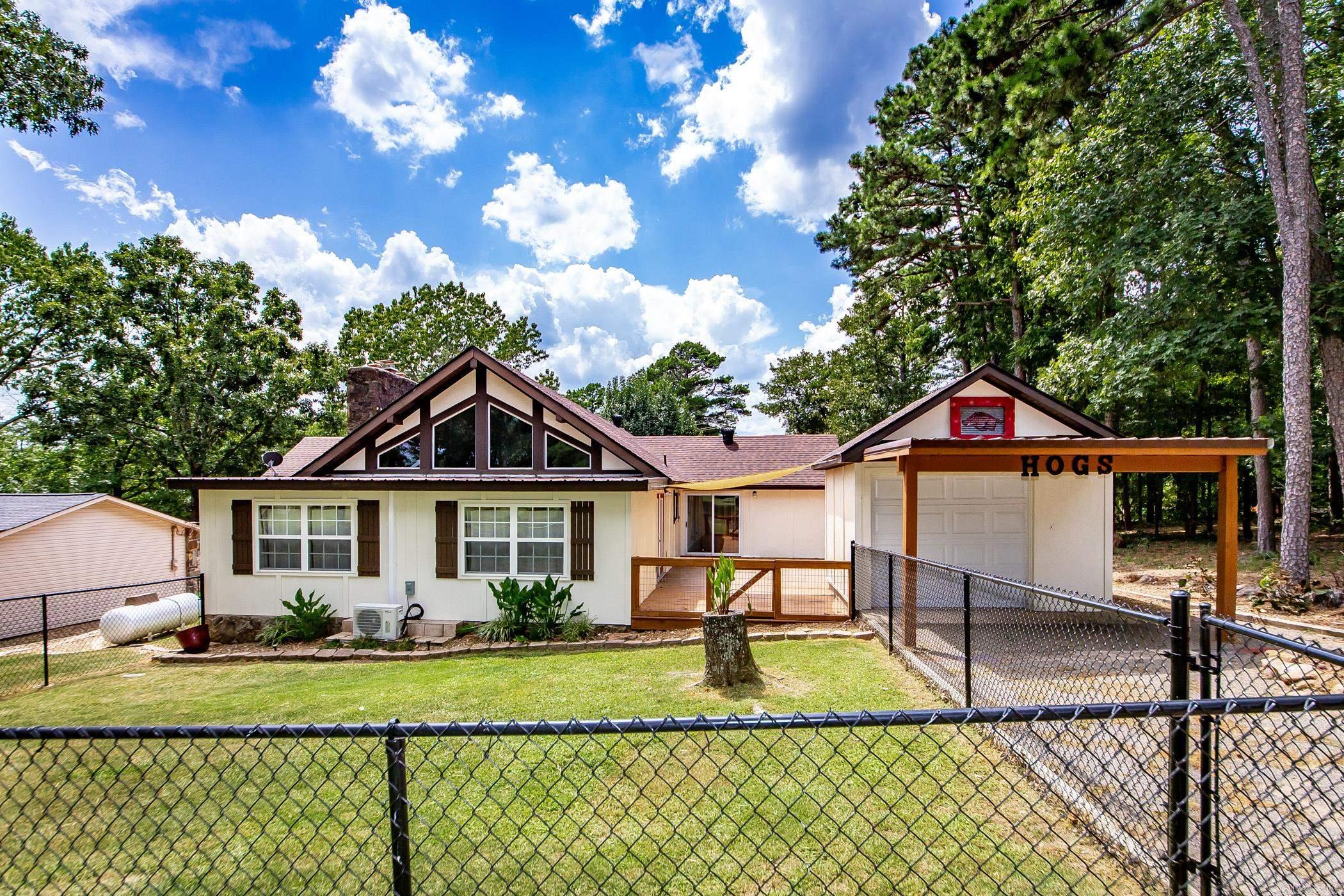 Welcome to this exquisitely remodeled home on Indian Hills Golf Course. This property promises a lifestyle of relaxation & leisure because all of the updates have been completed so you can enjoy a day on the course & sunsets on the lake. Step inside to discover a thoughtfully designed split floorplan highlighted by large windows & the spacious living room/dining area with new ventless gas logs in the fireplace. The kitchen includes a new stove & vent-a-hood. The refrigerator, washer, & dryer convey w/ the sale of this property. Immerse yourself in comfort with a suite of 2023 upgrades, such as a brand-new roof, a cutting-edge mini-split hvac unit, & a high-efficiency HVAC unit, newly installed windows & elegant french doors, & many other updates including painting inside & out. Fairfield Bay comes with unmatched amenities, including access to 3 sparkling swimming pools, vibrant playgrounds, well-maintained tennis courts, modern fitness center, hiking & biking trails, ATV/UTV trails, pickle ball, 2-18 hole golf courses, bowling alley & pristine Greers Ferry Lake. There is a lower level area workshop/storage & the golf cart garage/storage building. Come enjoy the life. New sewer pump