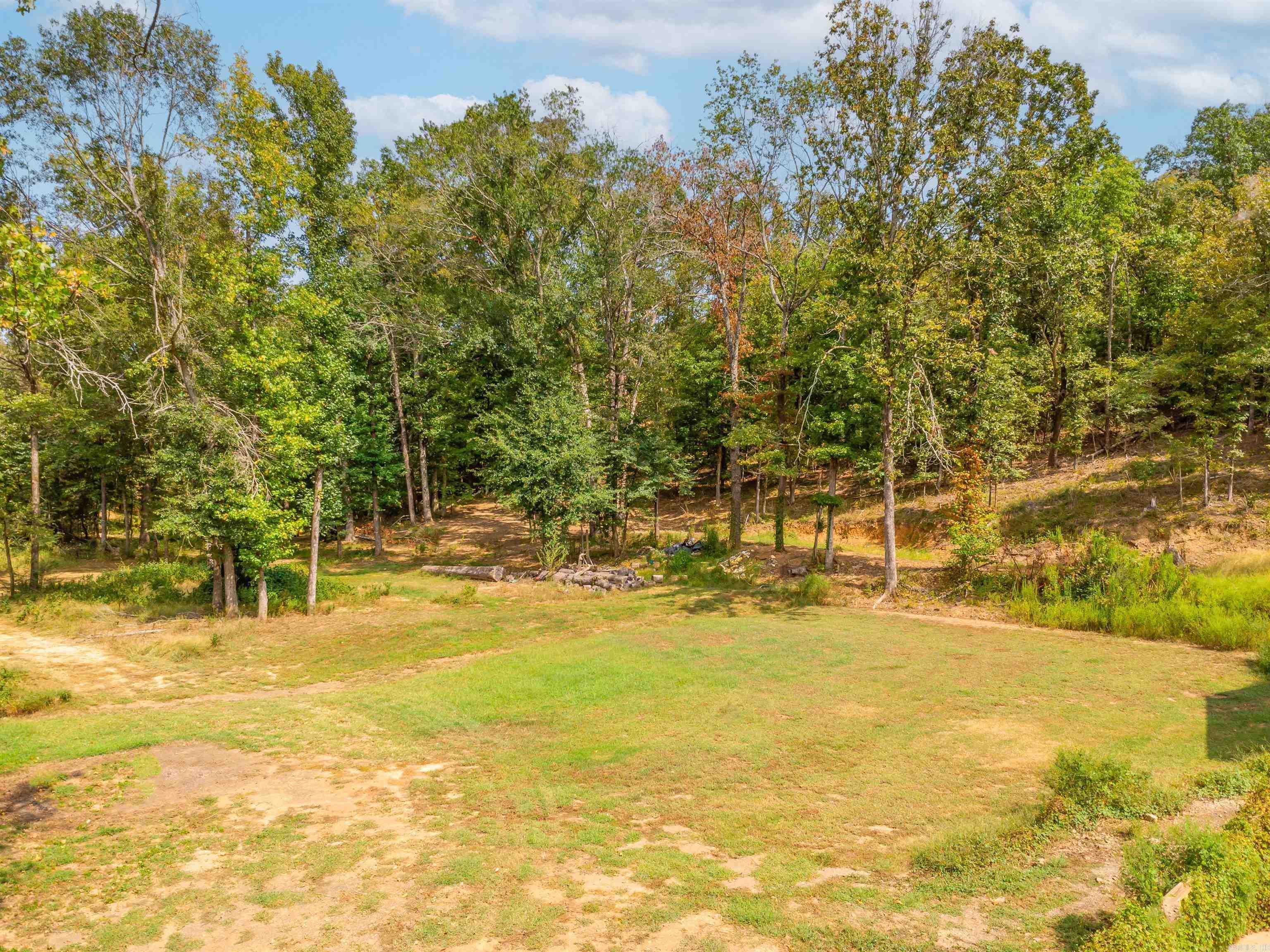 Discover the perfect blend of natural beauty and peaceful seclusion with these three adjoining lots totaling 25.47 acres. Nestled among tranquil fields and surrounded by breathtaking scenery, this expansive property offers a rare opportunity to own a pristine piece of countryside. Harve Creek gently winds through the land, providing natural charm and a serene atmosphere. The property features a mix of flat land, hills and wooded areas, making it ideal for a private retreat, hobby farm, custom home, or future development. Whether you're seeking a quiet place to build your dream home or simply want to invest in unspoiled land, this property delivers endless possibilities in a truly picturesque setting. Embrace the peace and beauty of rural life—your private escape awaits. The lots are separated on county records but being sold together.