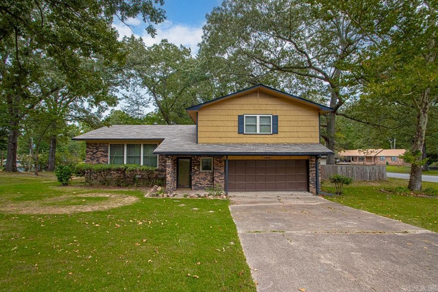 Situated on a corner lot in the desirable Southgate subdivision, this home offers quick access—just 7 minutes to Interstate 30 and 25 minutes to Hot Springs National Park. The fenced backyard includes a well-built outbuilding, perfect for storage or hobbies. Inside, you’re welcomed by a spacious foyer that opens to a large formal living and dining area. The kitchen features granite countertops and flows into the cozy den with a brick fireplace and doors leading out to the backyard. Upstairs, you’ll find three comfortable bedrooms and two full baths. A double garage completes this inviting property. AGENTS See agent remarks