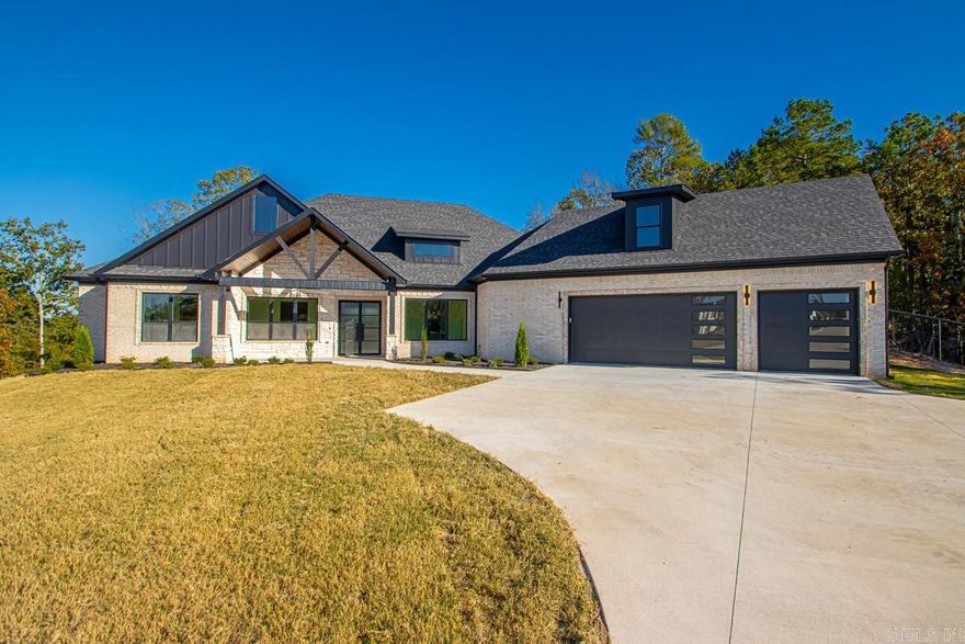 This stunning single-family home on 15011 Angus Ct in Little Rock, AR was built in 2025 and offers a spacious and modern living space. This split open floorplan offers, 2 large bedrooms and a sunroom on one side, a spacious office adjacent to the main living area which continues into a perfect dinning area. Complete kitchen with its walk in pantry and full bar area and secondary sink, compliment the large master bedroom with his and her closets. Don't forget to check out the large flex/ bonus bedroom or media room upstairs. Complete With 2 full bathrooms and 2 half bathrooms, this home boasts a total finished area of 3,334 sq. ft. Situated on a large mostly flat lot spanning 1.25 acres, there is plenty of outdoor space to enjoy. Don't miss the opportunity to own this beautiful property in a desirable location.