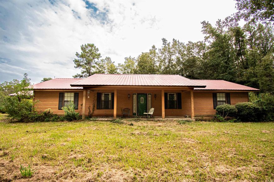 This home is to be sold as-is but has a ton of potential. On a 4 acre tract of land, with an additional piece of land around the shop, there is plenty of room. At the front of the property there is also a mobile home hook up. The house has 2 bedrooms and 2 bathrooms, a sunroom and a formal dining room also.