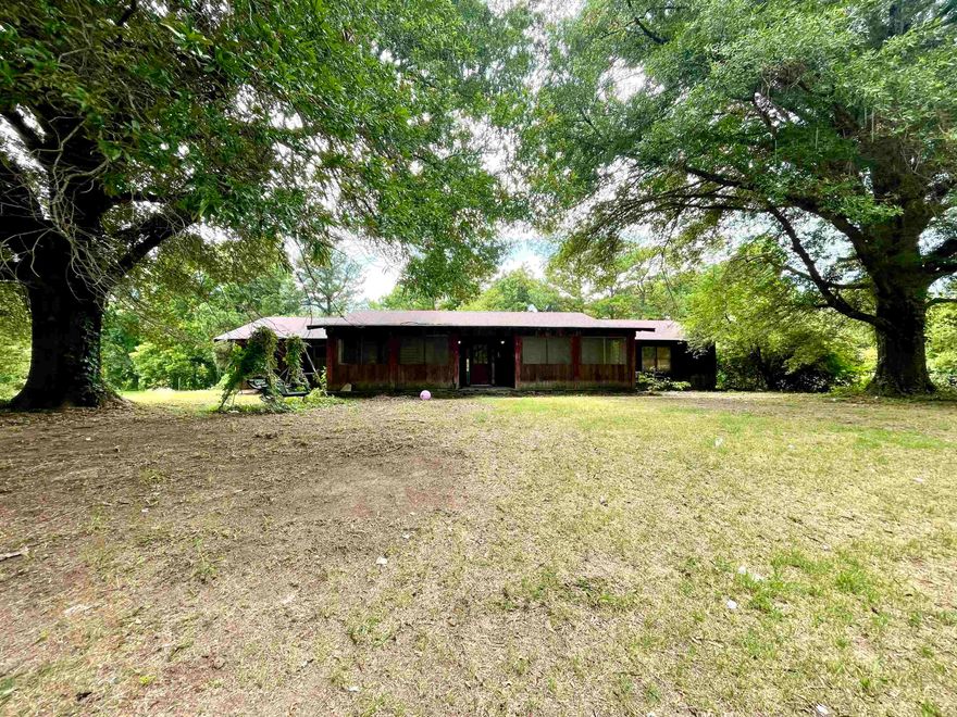 This unique property in Lepanto is what you've been waiting for! This home is over 2,500 sq. ft. on 1.4 acres near the Little River. It has all the rustic charm inside with beautiful wood ceiling details, wood beams, and stonework in the living room. The kitchen cabinets, interior doors, and trim work are all solid wood and custom as well. The living room is very large with a stone, wood burning fireplace insert with blowers. This home also offers 3 bedrooms, 2 baths, a spacious laundry room, a covered patio, and a covered front porch that could easily be fully enclosed if desired. The front yard is large with  Call your favorite REALTOR® and schedule your private showing!