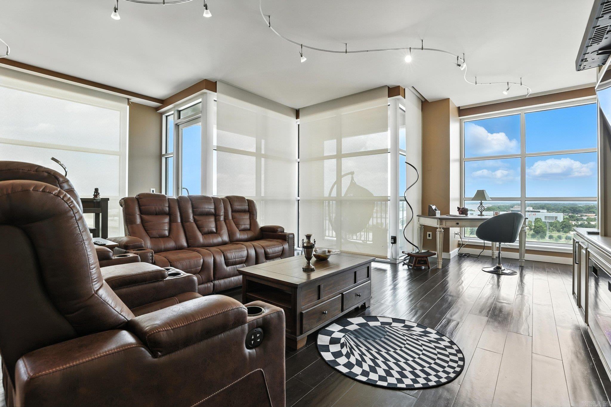Downtown living doesn’t get much better than this fully furnished, move-in ready 1 bed, 1.5 bath condo on the northeast corner of the 11th floor in the First Security Building. This unit is full of natural light with amazing city views from almost every room and a direct view of the amphitheater from your balcony. The open layout includes a breakfast bar, a spacious main bathroom with a walk-in shower, and a half bath for guests. There's even a full-service hotel on the first floor - perfect for visiting friends and family. Located in the heart of the River Market Entertainment District, you’re just steps from restaurants, bars, and everything downtown Little Rock has to offer. Very secure building with one dedicated parking spot in the garage, key fob entry, plus access to the hotel’s gym.
