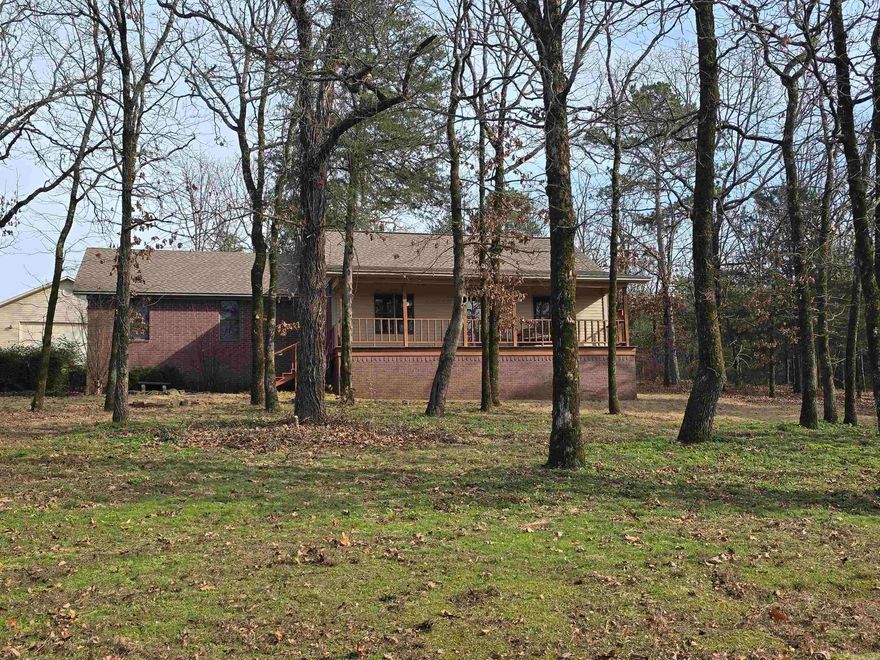 Newly updated home with a detached 2 car garage/shop with electric. New paint & flooring in all areas except for the spare bedrooms & kitchen, new guest bathroom vanity, hot tub (needs work)  & out building. Office area or sitting area, Wooded and in a cul-de-sac.  Roof on the home and shop only 2-3 years old. Brand new insulation under home. HVAC is maintained yearly. Play set.