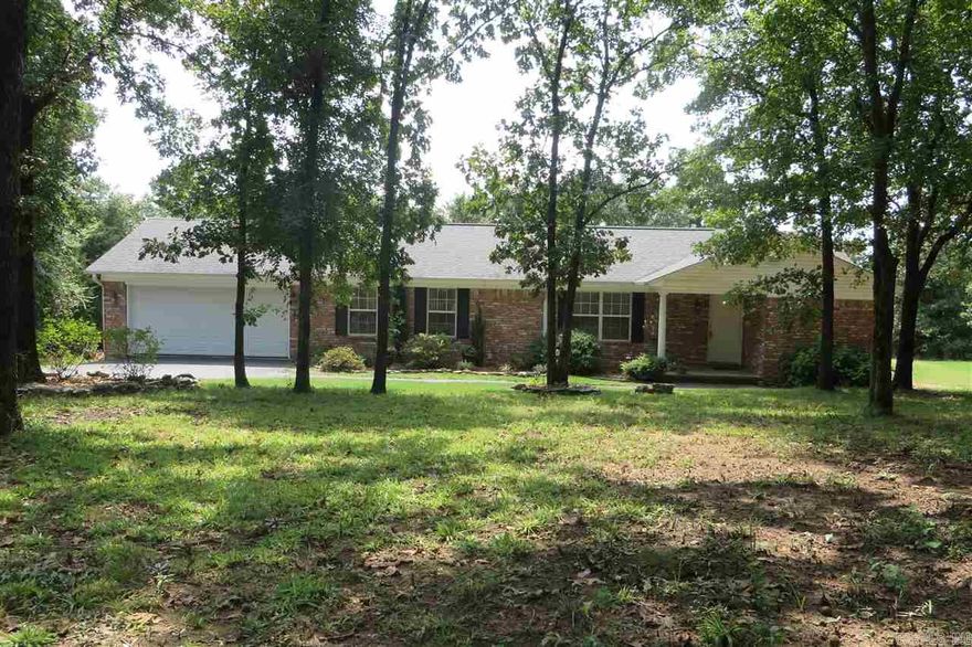 Centered in Privacy..... From the center of privacy, many people pass by this property and never know its even there. Quietly nestled into the corner of one of West Crow Mtn finest neighborhoods is this unique property only 12 minutes to Russellville for the Seller yet so quite that you feel like you have been magically transported to the middle of the Ozark Mountains.Previously renovated to include 2 master suites, 2 spacious decks ( one completely covered), Fire pit, and forested walking trail. 2.54 acres