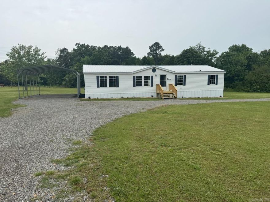 Charming country retreat on 2.5 acres! This beautifully remodeled mobile home offers the perfect blend of modern comfort and peaceful rural living. Nestled on a spacious, private lot, the property provides plenty of room for gardening, outdoor activities, or simply enjoying the quiet surroundings. Inside, you’ll find a completely updated interior featuring fresh paint, new flooring, and stylish finishes throughout. The open-concept living area is bright and inviting, flowing seamlessly into a fully renovated kitchen with updated cabinetry, countertops, and appliances. The home includes comfortable bedrooms and updated bathrooms designed with both function and style in mind. Step outside and enjoy the wide-open space—ideal for pets, hobbies, or even adding a workshop or additional structures. Whether you're looking for a starter home, downsizing, or investing, this move-in-ready property offers excellent value.