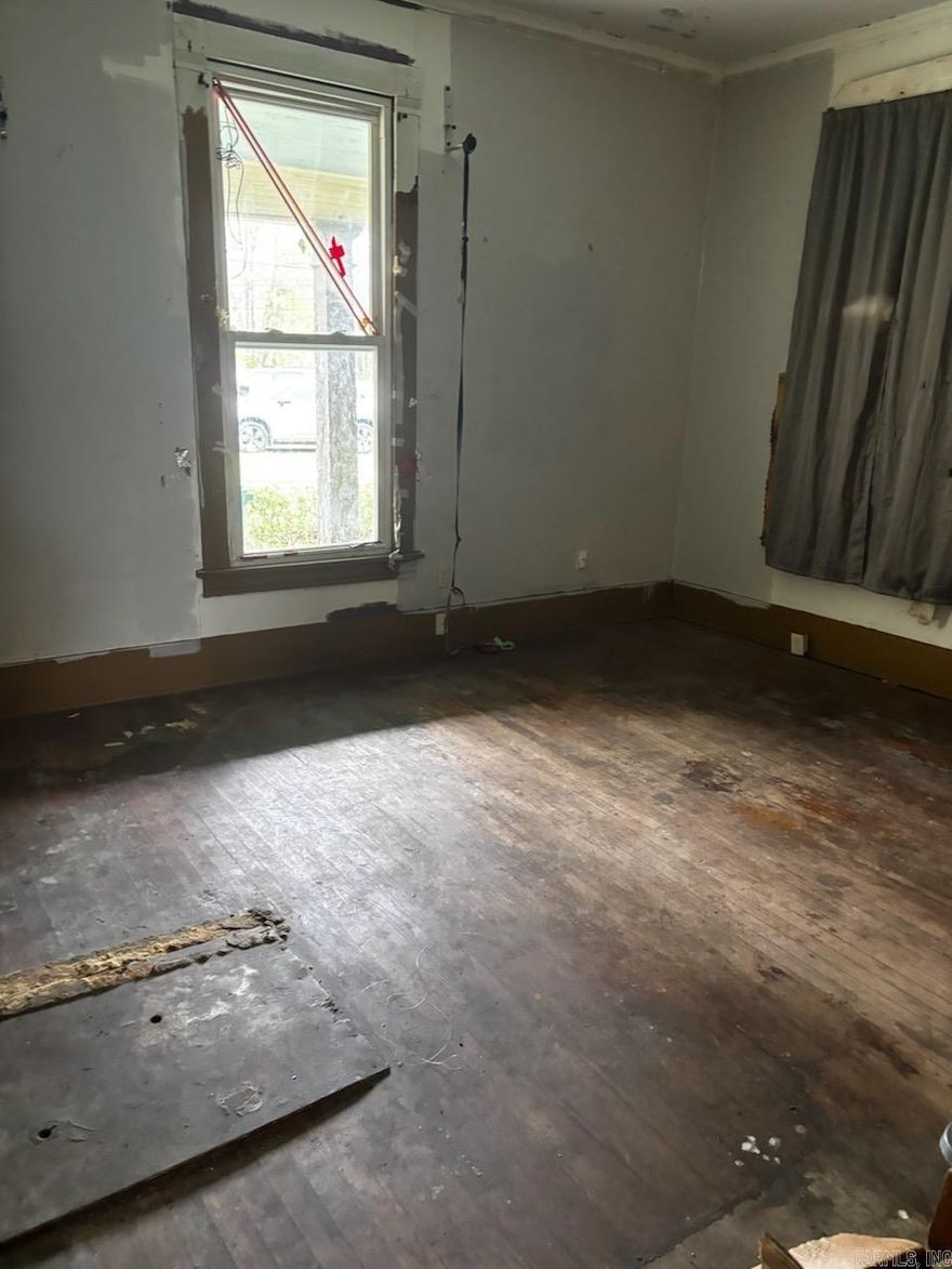 Large family home built in 1919. Investor special!!! Recently cleaned out. Needs major work. No interior access available prior to closing day. Off the kitchen there's a door to the backyard. Fenced in backyard. Would make a great rental again.