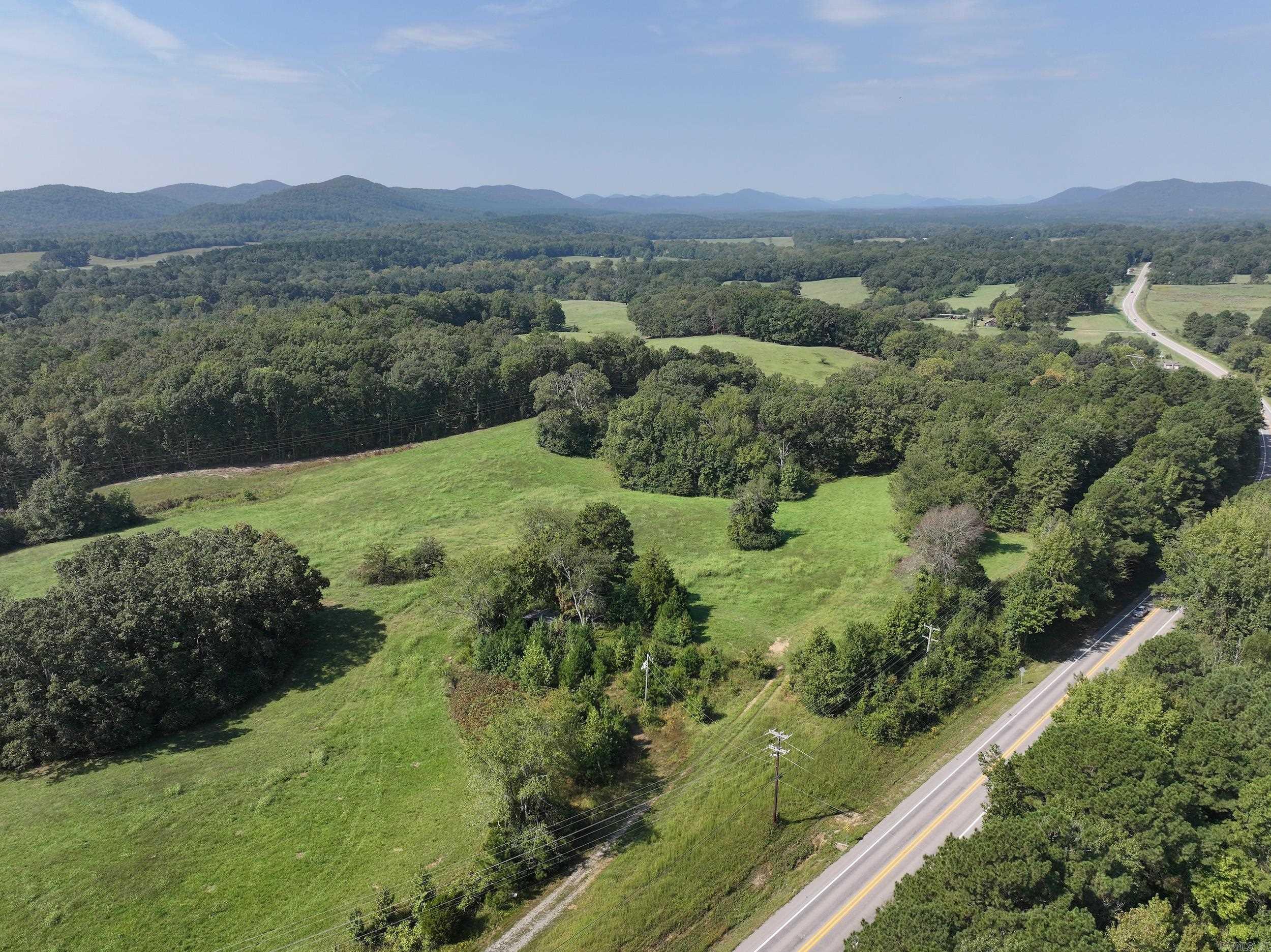 Approximately 29.30 +/- acres of scenic land located just outside the city limits of Glenwood in Montgomery County. This beautiful property features a pond, open pastureland, and expansive views — offering plenty of possibilities for agricultural use, recreation, or future development. Ideal for livestock or hay production, the land is well-suited for those looking to establish a working farm or enjoy rural acreage. With no city zoning restrictions, this is a great opportunity for those seeking space, seclusion, or investment potential. Come explore the natural beauty and wide-open possibilities this tract offers.