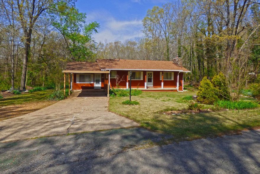 Three/Four Bedroom House on Two Flat Lots. This house has 3 bedrooms, a full, remodeled bathroom, living room with fireplace, large kitchen, and another large room that could be a 4th bedroom or family room, also has a great sun or sitting room, laminate wood flooring throughout. Septic, new in 2019. Has a shed behind the house that would be a great workshop, and an extra lot that would be perfect for a detached garage / workshop. All this located close to the Cherokee Village South Entrance.