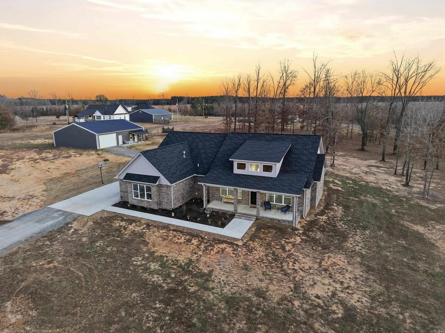 Sheridan welcomes you to this wonderful property in a highly desirable location. Custom built two years ago, this home features a split floor plan that creates both togetherness and privacy, giving everyone their own space to unwind. Each bedroom features its own private bathroom perfect for busy mornings or guests.  A private secondary suite offers the ideal space for a tween or teen wanting a little independence, a comfortable retreat. A built-in safe room adds an extra layer of security and peace of mind. A home office space that is sure to please. The heart of the home flows beautifully for everyday living and gathering, while the spacious primary suite provides a relaxing escape complete with a large walk-in shower, double vanity, and a large walk in closet. The fenced yard offers plenty of room to roam for kids and pets alike. The fully equipped smoke shack with utilities in place is ready for weekend cookouts and family celebrations. The large shop with its own apartment/mother-in-law quarters provides exceptional flexibility. Come see for yourself!!