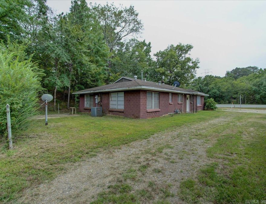 Location, Location, Location!! In central location! This all brick home sitting on .88 acres with 35 unit mini storage has tons of potential for short or long term rental property. Lake Catherine just a short distance away. Don't miss this great buy in Magnet Cove School district.