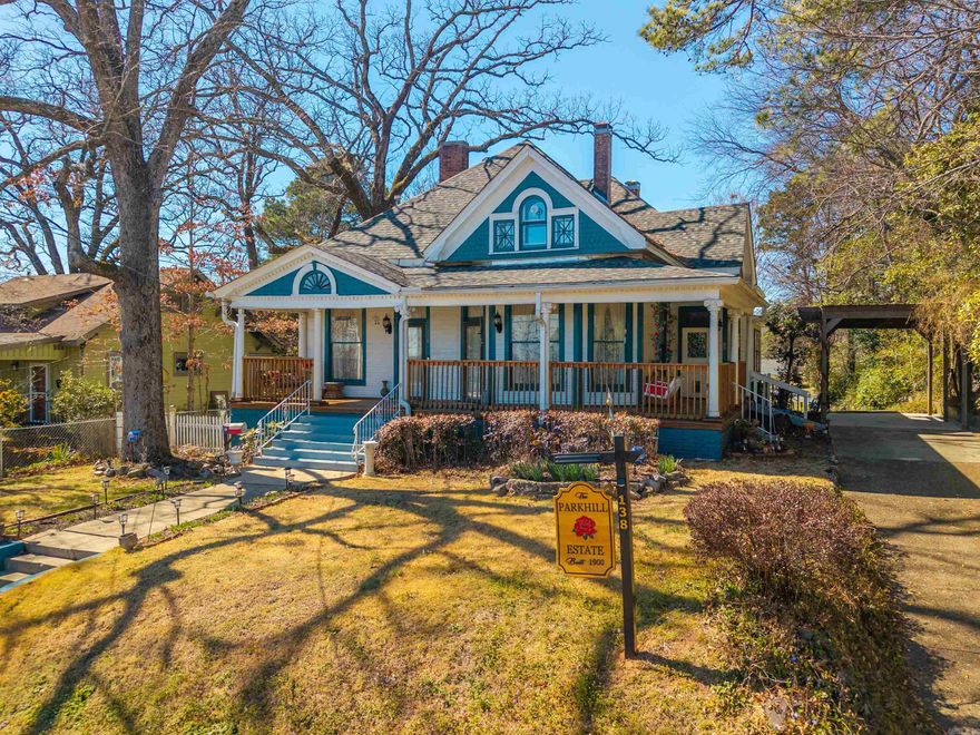 Step into a rare piece of local history with The Parkhill Estate, a distinguished Victorian home built in 1900 where timeless craftsmanship meets thoughtful modern updates. Nestled on a large, private lot along peaceful, tree-lined streets, this property offers the feel of a secluded retreat just minutes from Oaklawn.  The 4-bedroom, 3-bath residence spans approximately 3,000 square feet and features soaring ceilings, original hardwood floors, two spacious living areas, a dedicated office, and a welcoming front porch. The updated kitchen, modernized plumbing and electrical, and a roof replaced two years ago provide comfort and peace of mind, while abundant storage adds everyday convenience.  A newly renovated, furnished guest house offers ideal space for visitors, extended family, or rental potential. Outdoors, enjoy inviting seating areas, dry storage beneath the home, and a charming chicken coop—all on an oversized lot.  Blending Victorian elegance, rich history, and an unbeatable in-town location, The Parkhill Estate is a truly rare offering.