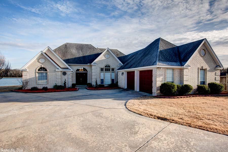 Listing Agent's personal home. This beautiful waterfront home is located in a quiet neighborhood at the end of a cul-de-sac. It has a huge master bedroom, walk-in closet, two fireplaces, and granite counter tops in the kitchen with an island that opens to a spacious entertaining room with a gorgeous lake view.