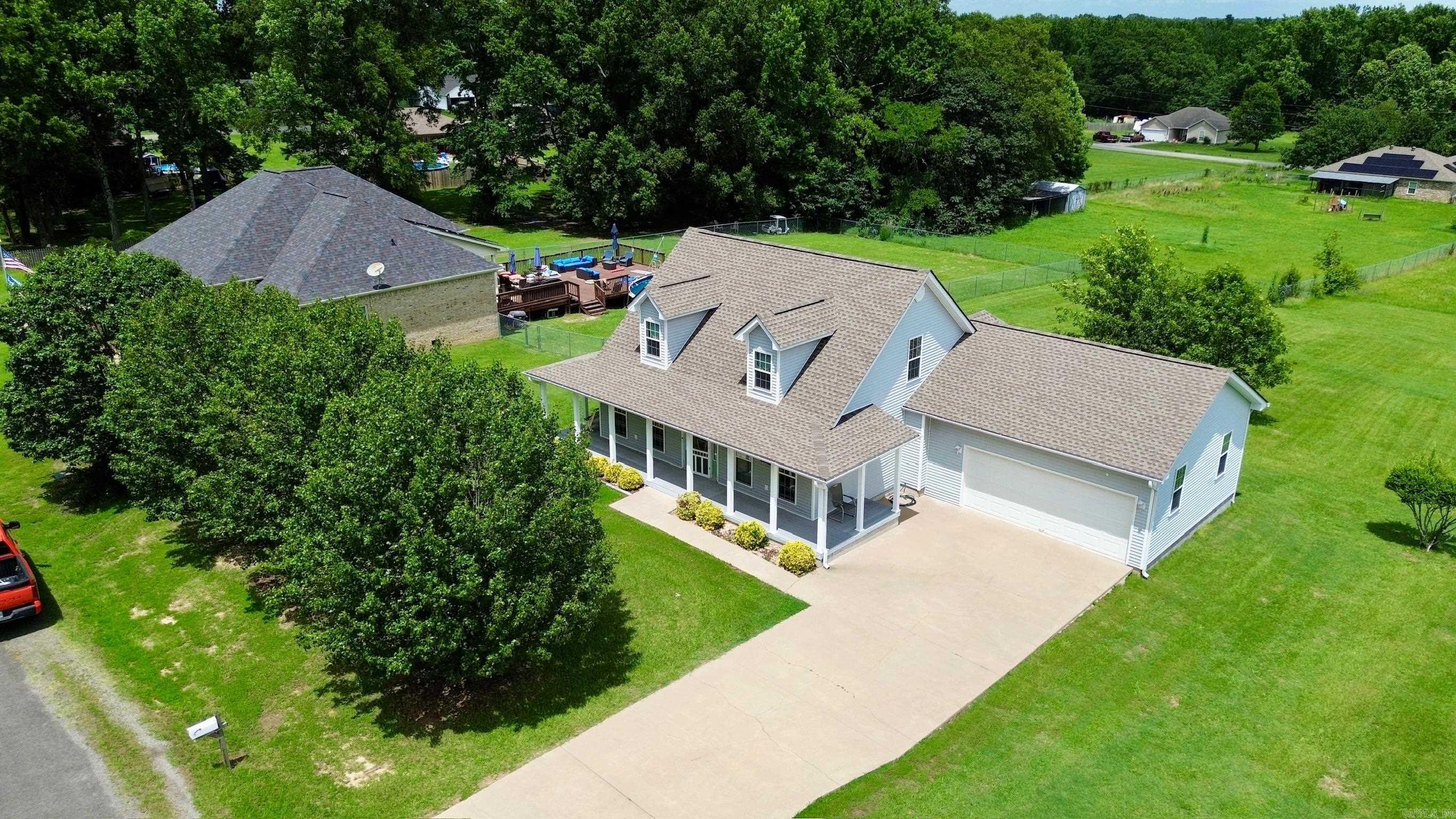 Welcome to this beautifully maintained 3 bedroom, 2.5 bathroom home on an oversized lot just outside the Cabot city limits. Enjoy peaceful country living with the convenience of nearby schools, shopping, and dining. A charming wraparound porch with durable Masonite decking and built-in speakers is perfect for relaxing or entertaining. Step inside to a soaring two-story entryway and gorgeous wild cherry hardwood floors throughout the main living areas. The kitchen offers stainless steel appliances, a pantry, and plenty of cabinet space for all your cooking needs. The primary suite is conveniently located on the main floor, while two additional bedrooms upstairs share a Jack and Jill bath. A separate powder room on the first floor is perfect for guests. With a roof less than three years old, a spacious layout, and move-in ready condition, this home has it all ā extra space, privacy, and an easy drive to everything Cabot offers.