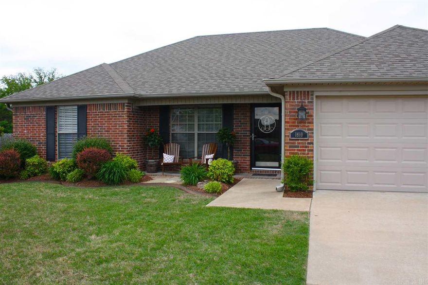 Move in Ready Gorgeous home.  3 BDR 2 Bath in a GREAT LOCATION.  Walking distance to Ellen Smith and Kidz University.  You will fall in love with this home as soon as you walk in.  Completely updated, new paint, Hand scraped maple hardwood flooring, tile and a travertine fireplace surround.  The back yard is an oasis, covered back patio and lots of landscaping!  This house won't last long!