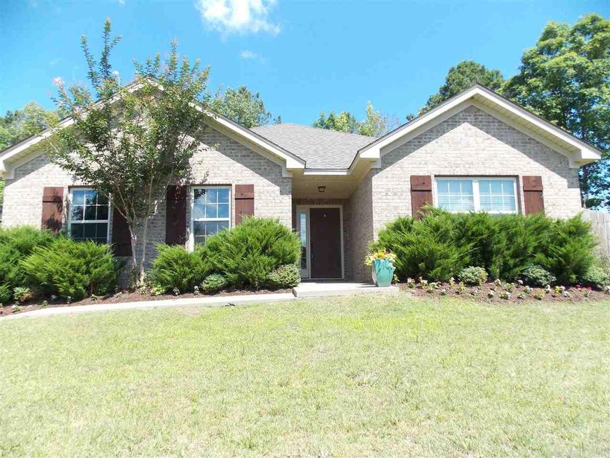 Better than new!  Custom home with beautiful hardwoods, large side-entry garage, 2" blinds throughout, Kitchen is open to living and dining space and the new deck on back makes it all perfect for entertaining.  This home sits on approximately one acre of land, some still wooded, in the coveted Pinewood Estates.  Bryant Schools!