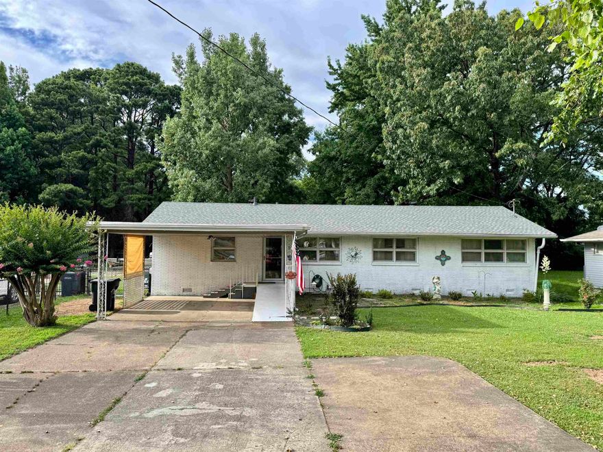 1110 W Nettleton is the Happy Little Home you've been searching for! Situated on a .34 +/- acre lot, this West End midcentury residence boasts 2,296 sq ft of well laid out and renovated living space, with fresh paint throughout, laminate flooring, and accessibility features including multiple ramps and wide doorways. New roof installed in 2025. The primary bedroom has a sitting area, walk-in closet, and full bath ensuite. There are two more spacious bedrooms AND a full office that could easily double as a fourth bedroom. But that's not all. How about the eat-in galley style kitchen, with bar seating & stainless steel appliances, formal living room complete with a gas log fireplace, crown molding, and French doors, the giant den with access to the back deck, laundry room, and ample storage space. In the fenced backyard you'll find a 12 x 20 covered deck perfect for gatherings, mature shade trees, and a barn style storage shed. This unique and well maintained home is conveniently located in the Jonesboro School District, and near public parks, and the fire station. Schedule your showing now!