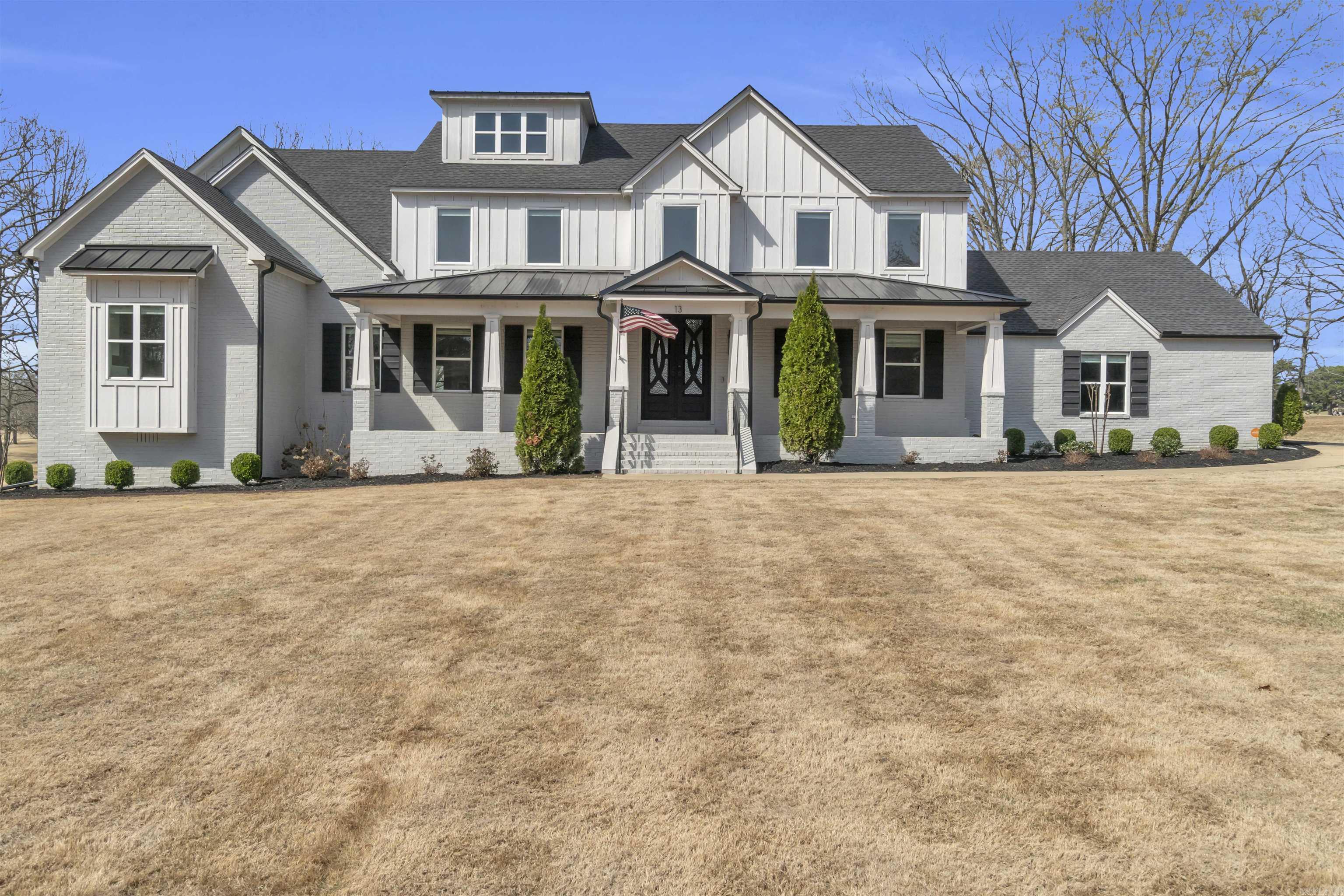 This stunning property boasts almost 5000 sq ft sitting in Searcy Country Club with beautiful views of golf course on 0.71 acres. Home was completely renovated, primary suite and bonus room were added in 2020 at time of renovation. A multitude of windows allows fantastic light filled spaces. Spacious living area features built-in shelving and fireplace which creates an inviting atmosphere. Chef's kitchen with quartz countertops, stainless steel appliances, ice maker, walk-in pantry, eat-in kitchen area and central island w/breakfast bar. Separate dining, office and laundry downstairs. The large primary suite located on main level features luxurious spa inspired bath with soaking tub, walk-in shower and large walk-in closet. Upstairs has 4 bedrooms, 2 full baths and huge bonus room with vaulted ceilings. Covered patio, outdoor kitchen, iron fence and additional storage space underneath home. Complete home generator was installed less than 2 years old. Two car garage, golf cart storage area and Seller added additional driveway which allows for multiple vehicles. All appliances will convey with home. Call today to see this amazing home. SEE AGENT REMARKS!