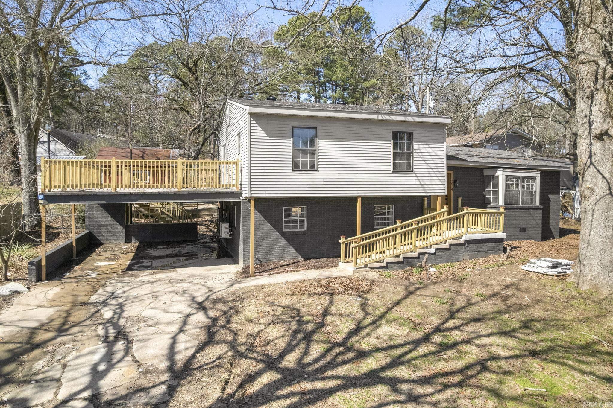 Check out this beautifully renovated 3-bed, 3-bath split-level home! Recent upgrades include new flooring, quartz kitchen countertops, modern hardware, stylish vanities, and tiled showers. All bedrooms are conveniently located upstairs, while a spacious bonus room downstairs offers flexibility as a family room, game room, or even an extra bedroom. Step outside to a large patio above the carportāperfect for grilling, lounging, or sipping your morning coffee while taking in the serene lake view. A newly built retaining wall enhances both curb appeal and function, providing improved water runoff and a more usable outdoor space. With a generous lot, thoughtful updates inside and out, and plenty of room to relax or entertain, this home is ready to welcome its new owners! No property disclosure available.