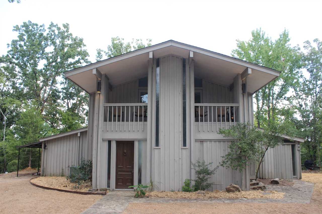 Eden Isle furnished LAKEFRONT!!! This might be the very closest house to water on the entire island! Spectacular lake views; you can hear the waves hitting the beach from the patio and deck! 3-bedrooms, 3.5-baths, Eden Isle Architecture with lots of glass (ALL rooms view the lake!)! Both upstairs bedrooms have private decks! Located at the end of Fox Chase Road past the marina, the location simply can't be beat! And yes, the water in the pictures really is that close!!!  130 feet of lakeside frontage!!!