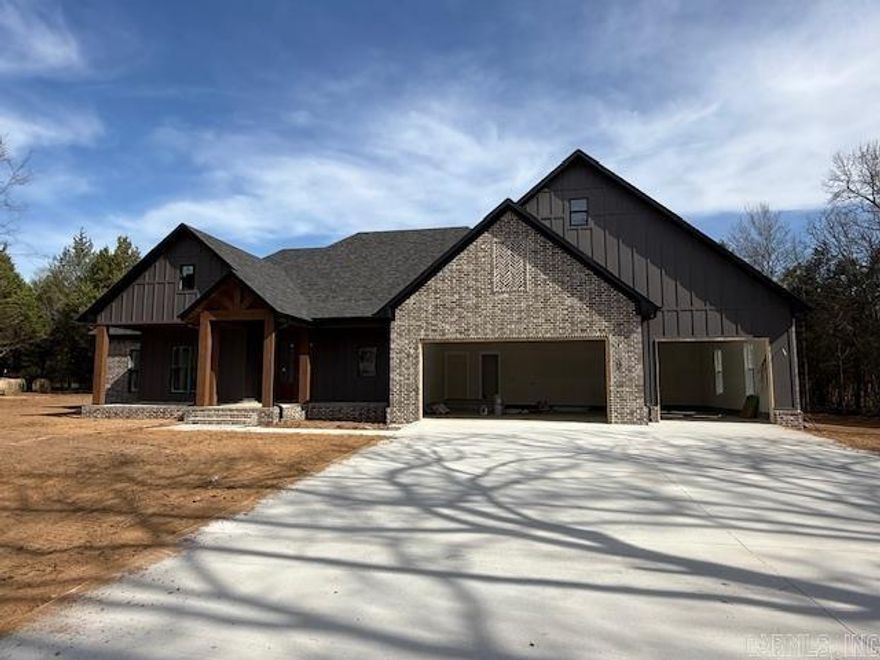 This home is located in a brand new subdivision in Greenbrier. It has a very large backyard with trees to buffer the view of the neighboring homes. The large back porch is great for entertaining. Inside the home you will find high ceilings and large windows.  Abundant cabinetry with a hidden pantry with shelving for all the items that you don't want to be seen on your countertops. Granite countertops throughout the home. Enjoy the view from the living room into the backyard while sitting in front of the cozy fireplace. Coming in from the garage is a half bath with lockers for coats, shoes and bags. You can circle through the laundry room into the primary closet through the bathroom and into the bedroom. You will enjoy the soaking tub and separate shower. You will appreciate the storage in this home! The 3rd car garage is extra deep for a trailer, boat or extra storage.
