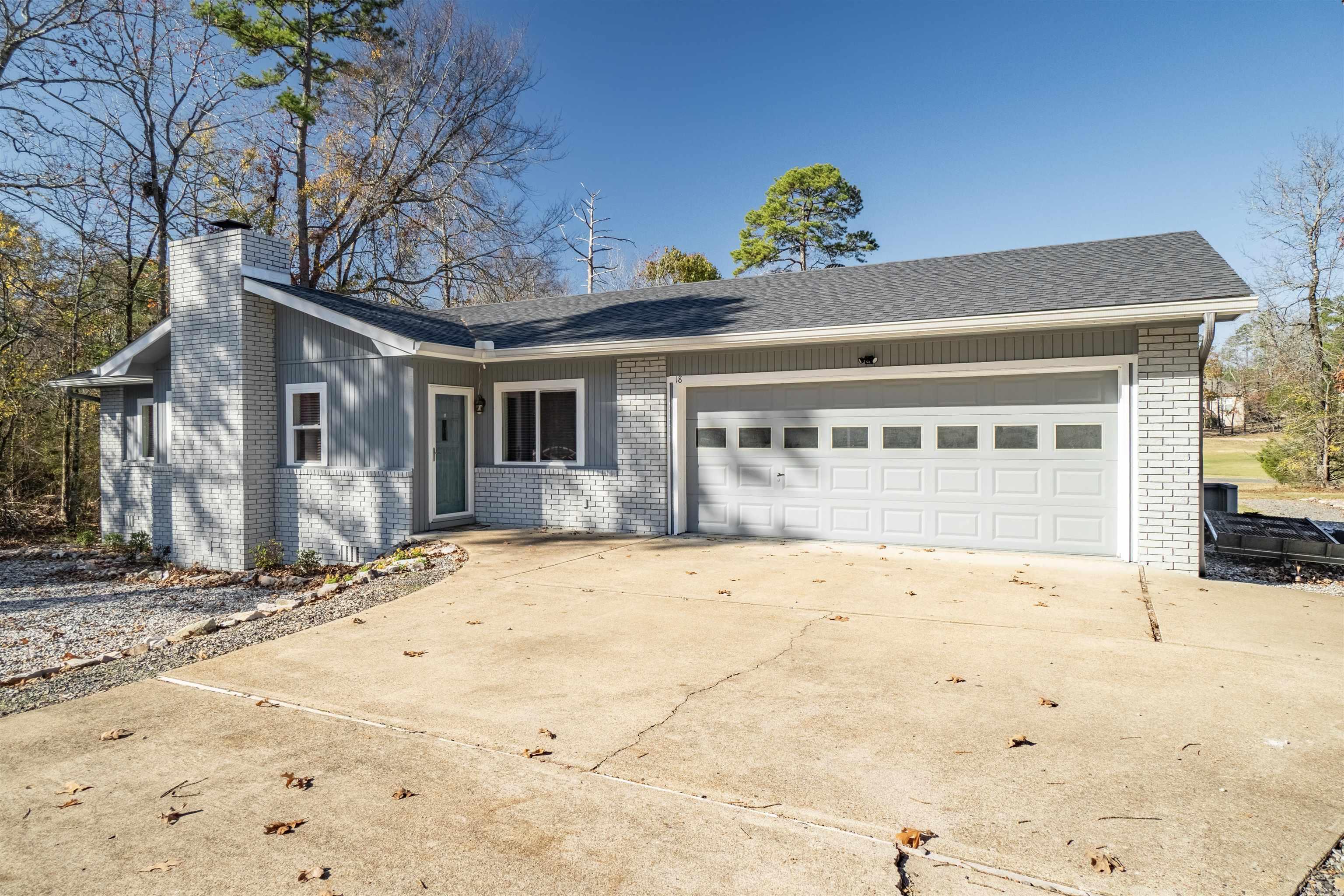 Welcome to this great Balboa Golf Front Ranch Home on a beautiful level lot. It is a move in ready stair free home with 3 bedrooms, 2 bathrooms, an Arkansas room, a deck, and a 2-car garage. Updates in 2023 include; new roof with gutters and skylights, master bath remodel, new flooring, appliances, and crawl apace insulation. New windows & exterior doors in 2020. Additionally, the home has been freshly painted inside and out. Home is located near lake Balboa, and the Danville member's gate. Enjoy all the amenities of Hot Springs Village. A recent appraisal available.