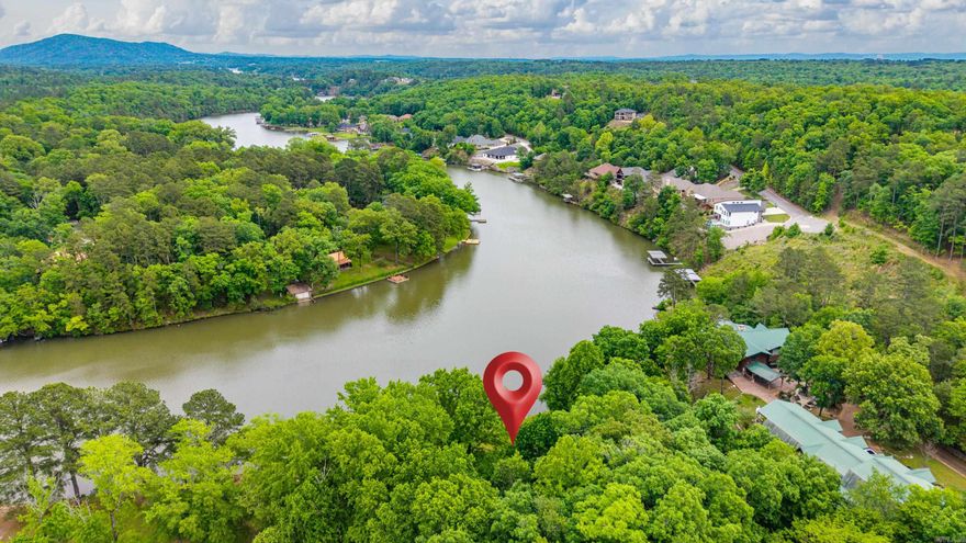 The coolest house in Hot Springs! This stunning tri-level Lake Hamilton waterfront home offers approximately 3,900±- square feet with plenty of room for everyone. Currently operating as an active 5-star, STR. The home has many bookings 2026 for immediate income sleeps up to 16 guests and presents an excellent opportunity for personal use, investment, or both. Comes FULLY FURNISHED!!!!  The home features 5 spacious bedrooms, including 4 with king beds and 1 with a queen bed, plus 3 rollaway twin beds for additional sleeping space. There are 3 full, oversized bathrooms, all thoughtfully furnished and equipped with the amenities guests and owners will appreciate.  Designed for comfort and entertaining, the layout includes huge rooms, 2 large wraparound decks, and a lower level with 2 generously sized bedrooms, a large laundry room, and an impressive game room complete with a pool table and foosball table.  This awesome waterfront home is being sold fully furnished, including indoor and outdoor furniture, making it truly move-in ready and turnkey.