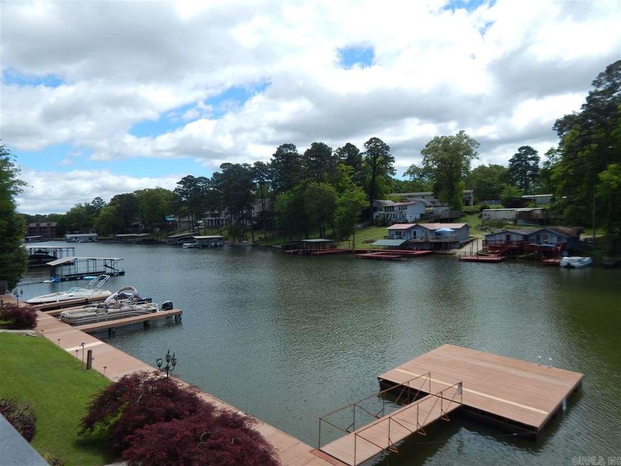 Luxury Lake Living close to everything! Close to Central and Restaurants and Shopping! On Lake Hamilton on Quiet Cove! Very nice 2 BR 2.5 Bath Condo is walk in and available now! Fully Furnished kitchen including a separate ice-maker by sink, Almost new SS Fridge and Washer & Dryer in Laundry Room! Tall Ceilings with crown mold throughout!  Liv Rm & Master both access 8x32' covered balcony 30' from Lake! Open Floor plan has granite in Kitchen and pavilion, waterfall, swim dock and boardwalk! $1350/mo.