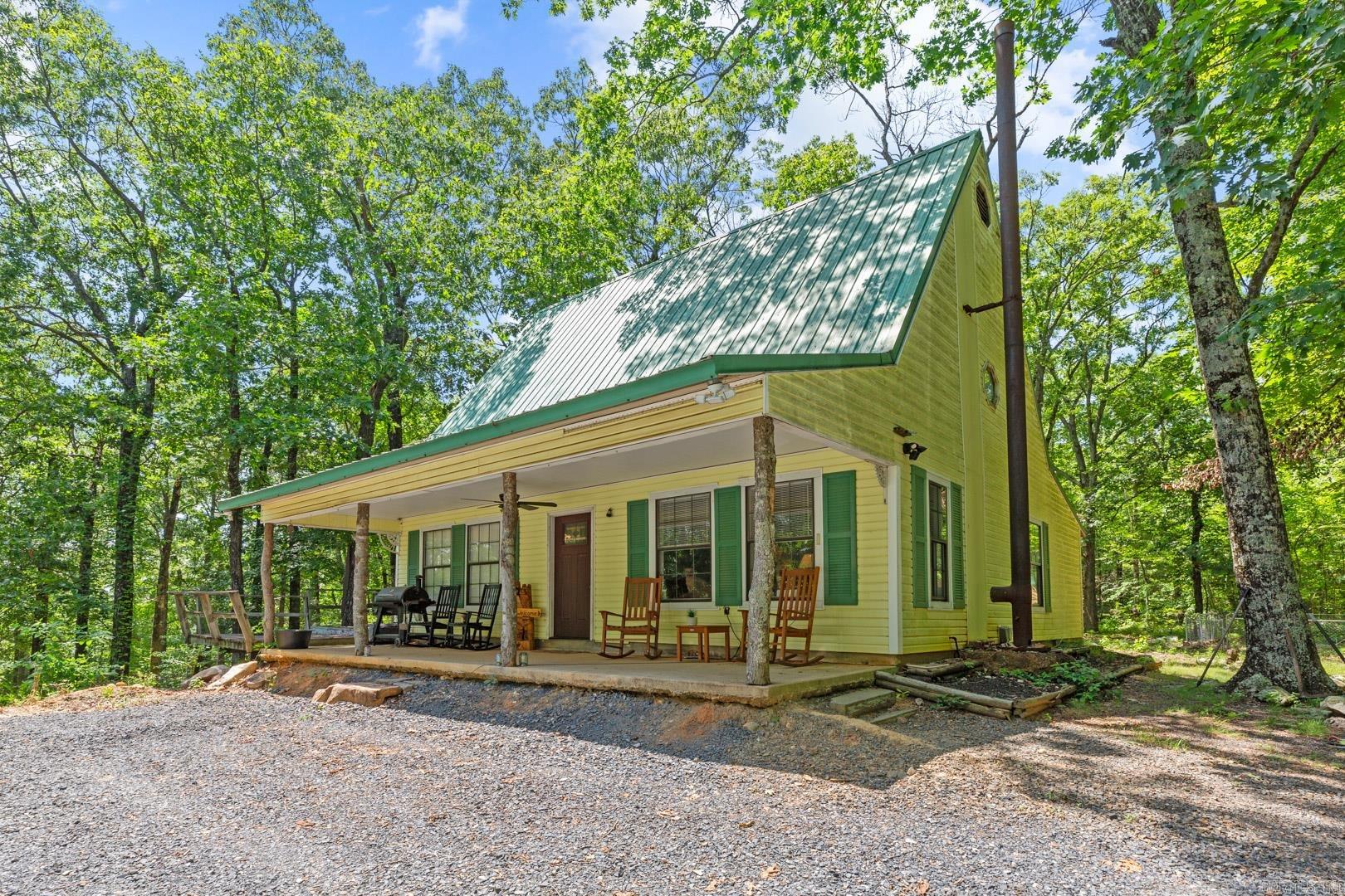 Nearly 100 wooded acres with panoramic mountain views, privacy, and a fully updated home! This 2BR/1BA home sits at the end of the road for unmatched seclusion. New kitchen, remodeled bath, and other upgrades. Property includes a spring, landscaping, storage building, and chicken coop. Multiple build sites with breathtaking views make this ideal for a homestead, mountain bike community, or private retreat. Near the proposed Mena mountain bike trail system. A rare chance to own acreage with development or lifestyle potential. Listed at $850,000.