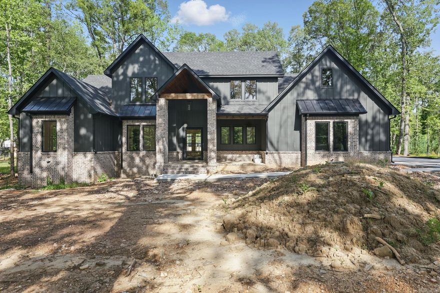 Welcome to this beautiful new construction home in Hazel Oak of Benton! You will appreciate the acreage lot and everything this spacious home has to offer. This top tier builder has thought of everything for this home, with features that include: wood floors and stairs, wooden beams, vaulted ceiling, tongue and groove work, pre-wiring for surround sound and alarm system, custom accent walls, and spray foam insulation.  The kitchen is a chef's dream with double ovens, ice-maker, custom cabinetry, pantry, and a large island. The special touches extend to the outside as well, with a large covered patio featuring a fireplace, irrigation system, and an extended driveway for plenty of parking. This 5-bedroom (the 5th could also be an office/flex space), 3.5-bathroom home has everything needed for family entertaining.