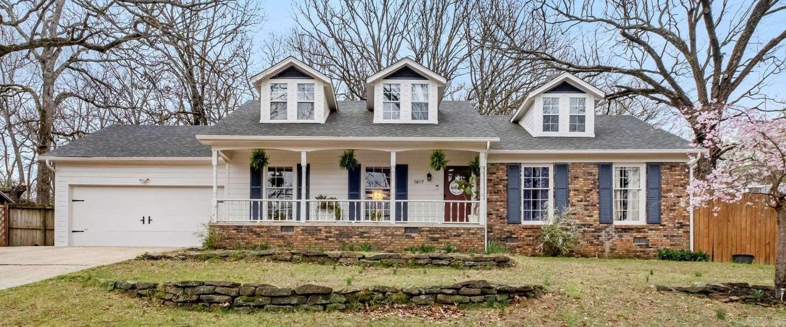 Classic Fayetteville charm with modern amenities awaits. Turnkey 4 bd/3 ba home situated on almost half an acre in a wooded enclave. Be in the middle of it all while feeling miles away. Bought in 2018 and intended as a forever home. Added new wood flooring and refinished original wood flooring in downstairs common areas. Renovated kitchen and dining area in 2022. New deck and side yard overhaul in 2023. Upstairs primary bathroom renovated, wood siding re-sealed and painted, original downstairs windows refurbished and front door replaced in early 2025. Both HVAC units, roof, and water heater replaced in last 5 years. The updated kitchen/dining area and adjacent living room are semi-open concept, designed with family gatherings in mind. Down the hallway you'll find a main floor primary with en-suite bath, 2 beds and another full bath. Upstairs is a cozy, private sanctuary with dormer alcoves and a wet bar, and a 4th bedroom with its own newly renovated full bath. With two options for primary, you can choose to be close to the other bedrooms or far away, and change as the needs of your family evolve. Come see your new home today.