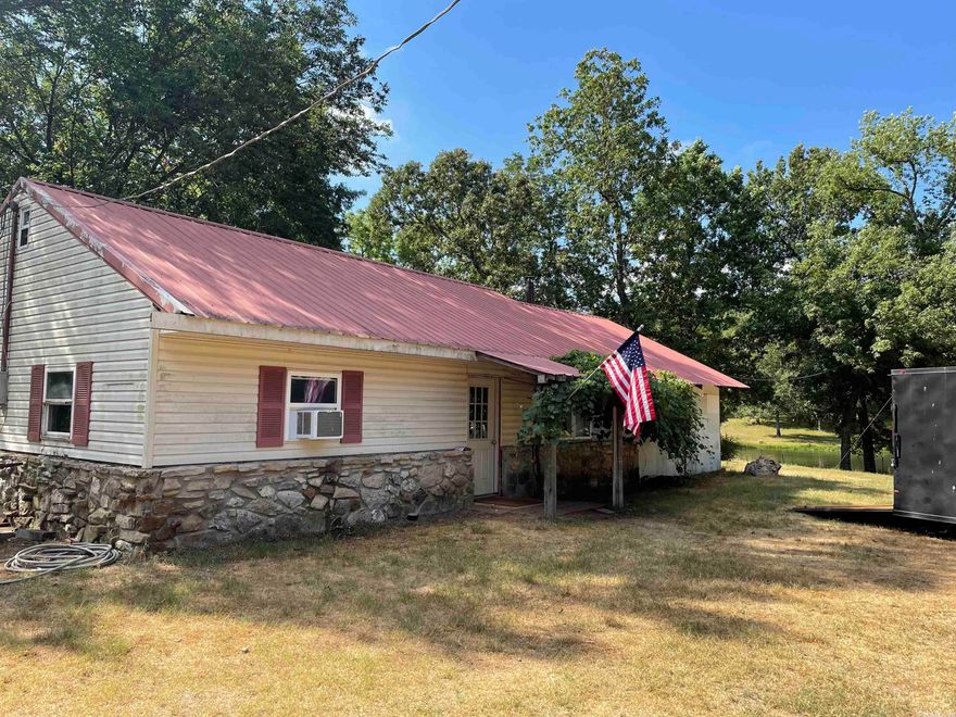 Country home with access to fishing/swimming lake and creek. 2 bedrooms 1 bath- All Electric with range & refrigerator. Split unit for heat/air plus a window unit. Tile floor in kitchen and laminate living and bedrooms-no carpet. Large attached shop (520 sqft). This is a beautiful piece of property. Each adult must complete an application for credit & crim background check. Proof of income required. $20 added to rent for pest control. Renter's insurance required.