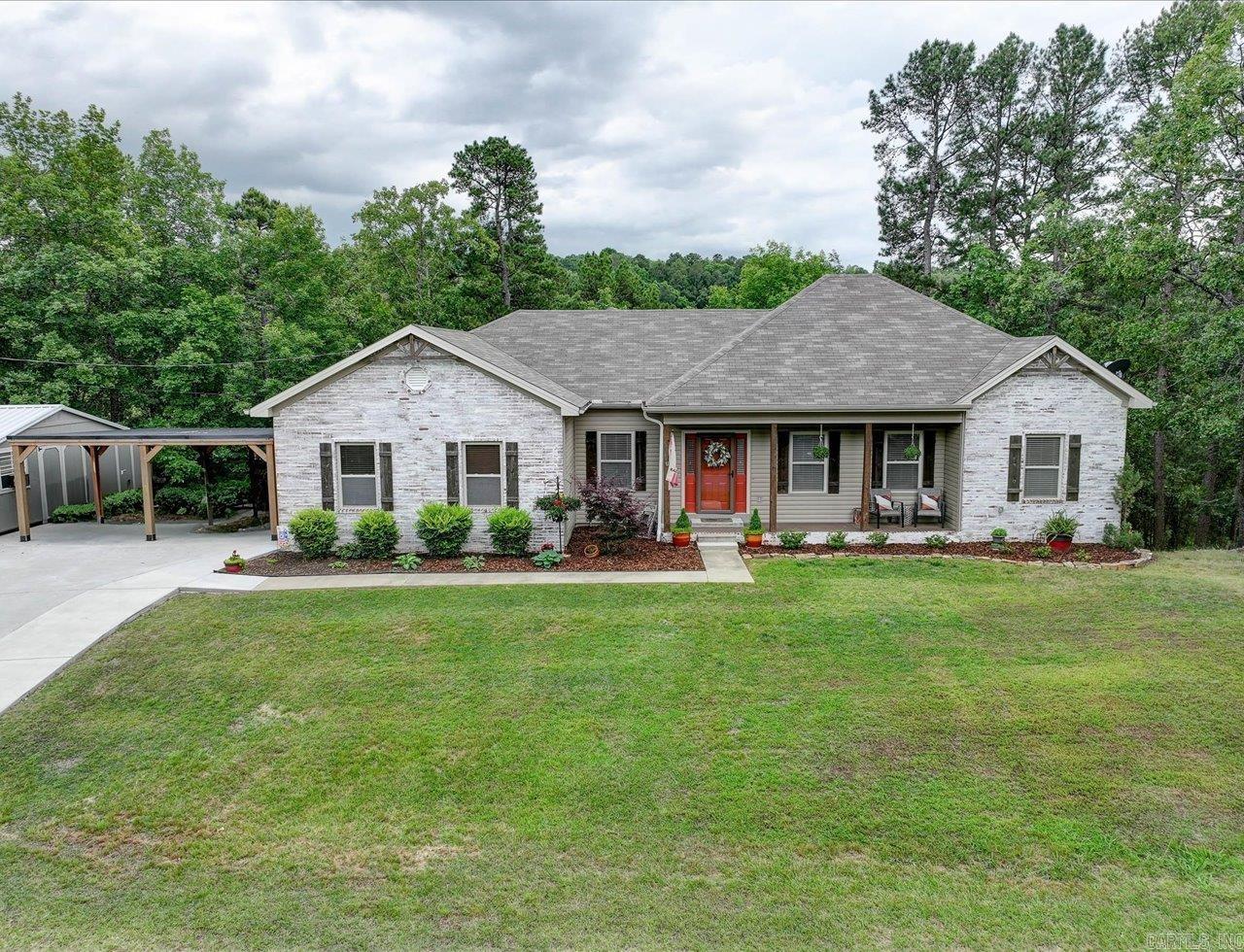 Welcome to this beautifully updated 3-bedroom, 2-bath home, offering 2,026 square feet of stylish, comfortable living space on 3.46 serene acres in the heart of Diamondhead. Blending modern classic design with thoughtful upgrades, this home is move-in ready and made for both relaxing and entertaining. The updated kitchen is a chef’s dream, featuring sleek countertops, ample cabinetry, and a premium dual fuel range. The spacious master suite includes a freshly remodeled en-suite bath with contemporary finishes. A recently added family room offers the perfect gathering space, complete with an elegant electric fireplace to set a cozy mood year-round. Outside, enjoy the peace and privacy of your expansive property, tucked within a quiet, established neighborhood. As part of the Diamondhead community, you'll have access to a host of amenities including a golf course, community pool, clubhouse, lake access, and a library. Ideally located just minutes from the natural beauty of Lake Catherine State Park and the vibrant shops and dining of downtown Hot Springs, this home offers the perfect balance of comfort, style, and convenience. Don’t miss your chance to make this exceptional prope