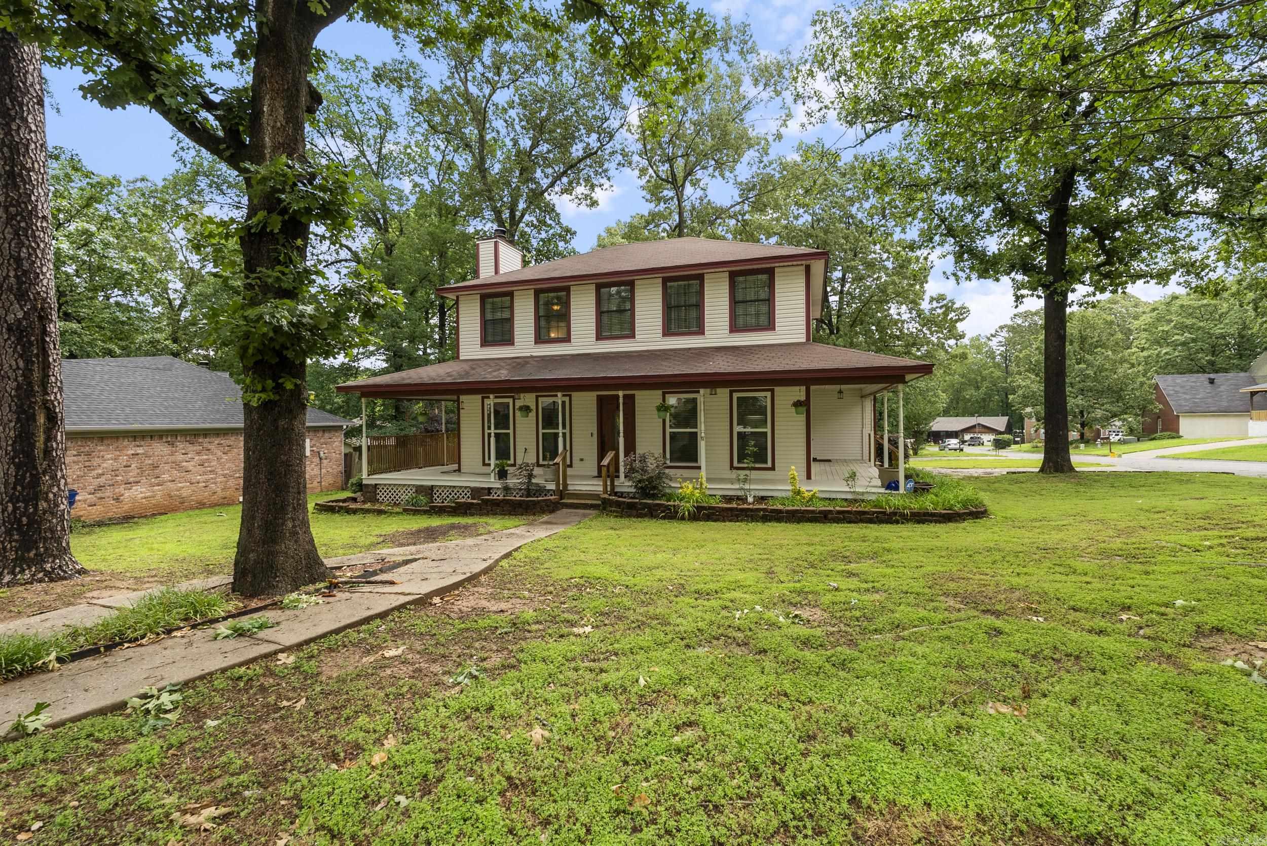 Experience the best of Southern Summer living in this charming, two-story High Timbers home. A spacious wrap-around porch invites relaxing evenings and morning coffee, perfectly complementing the beautifully landscaped "corner-like" lot. Step inside to find an updated kitchen with granite countertops and modern appliances. New flooring has been added upstairs to match the stylish design of the lower level, creating a seamless feeling throughout. The primary bathroom has also been recently updated for a fresh, modern touch. Updated include new paint, new flooring, and quartz counters. Practical updates include a fully encapsulated crawl space with a dehumidifier, offering peace of mind and long-term protection. The garage was split in half to create a 4th bedroom/flex space and exterior storage. Outside, enjoy a fully fenced backyard featuring a handsome wood fence that ties in with the porch for a cohesive outdoor space. Mature trees have been carefully pruned or removed, opening up the nicely sized front yard and enhancing curb appeal. Don't miss the opportunity to make this inviting, move-in ready home yours.