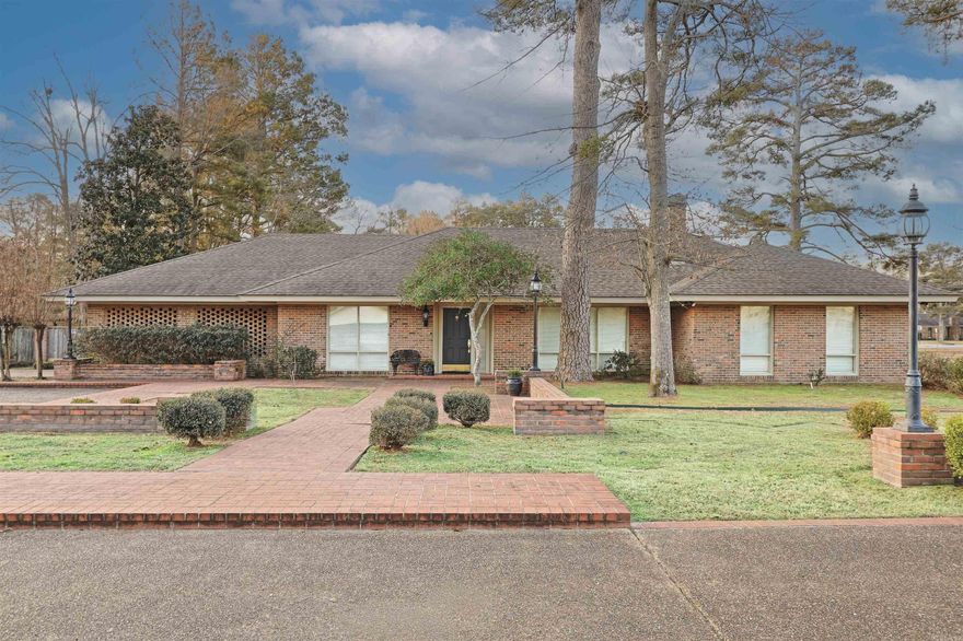 This beautiful custom built one level home was designed for entertaining and privacy. Truly a one of a kind gem close to the hospital and country club. All 3 bedrooms have their own bathrooms, with a 4th full bathroom in the den with a shower for pool use. The master suite has 2 large walk in closets and a gorgeous master bathroom. The Chef's kitchen boasts a Viking range and hood and Subzero refrigerator. French doors in the den, living room and master bedroom all open to the backyard of your DREAMS! Plenty of room to entertain on the expansive brick patio and custom swimming pool.  A shop for storage and even a hidden dog run. So many extras...cedar lined closets, built-ins, hand crafted moldings, and a security system. Seller requires a 24 hour notice and preapproval letter/proof of funds prior to showings. Listing agent must be present.