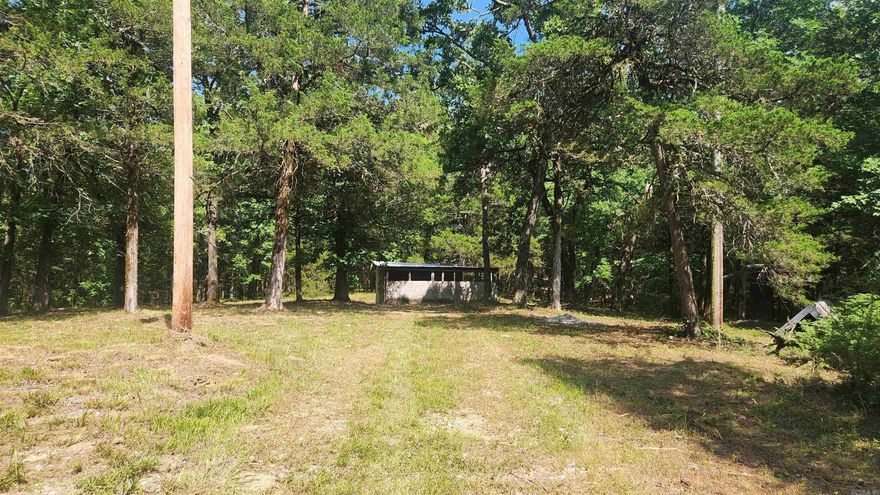 1.5 acres joining Ouachita National Forest near Lake Ouachita. This tract of land has been used as a hunting camp for years. On the east side it joins Ouachita National Forest. There is a well casing but not a pump. There has been power there in the past but does not have a meter loop at the moment. A septic will need to be installed. All mineral rights convey. There are no restrictions. Give us a call.