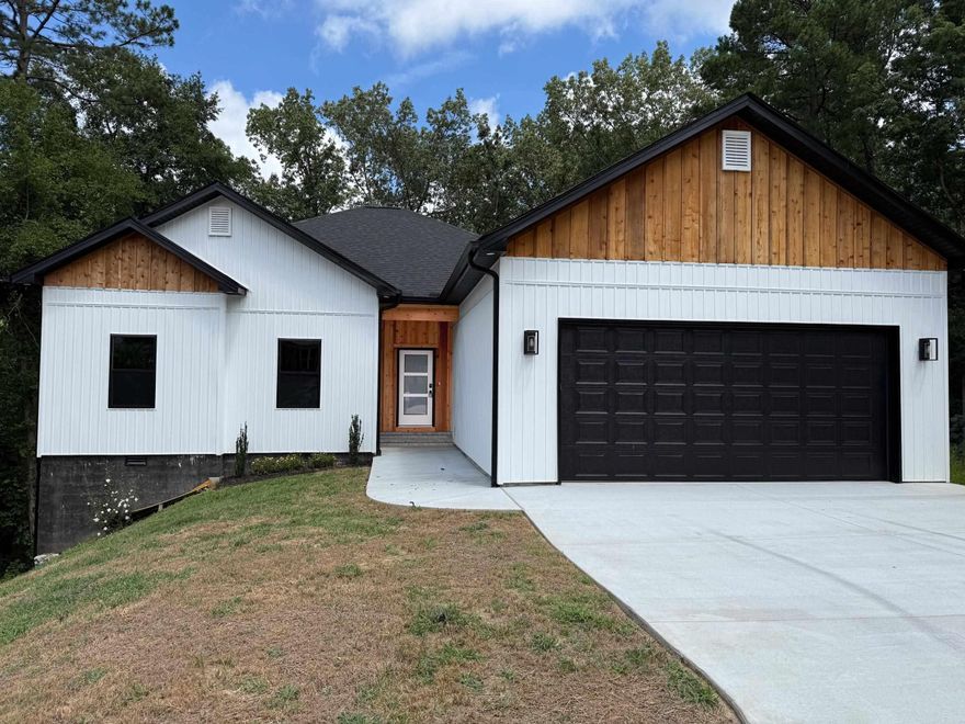 Charming new home in quiet cul-de-sac situated in an established neighborhood offers a serene retreat backed by woodland views combining modern amenities with a peaceful setting. Features & highlights include: desirable split floor plan, private primary suite with deck access, open floor plan perfect for entertaining, kitchen with large breakfast bar and eat in dining area.  Cozy living with fireplace, luxury vinyl flooring throughout.  Enjoy additional entertaining space and storage in the finished basement with half bath and walk out to the lower deck and back yard.