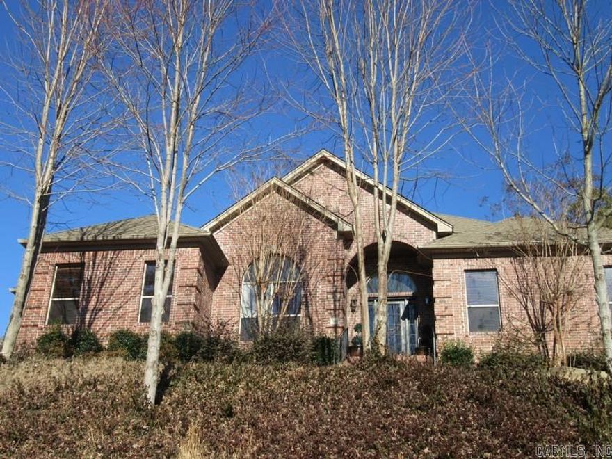 One level, very open floor plan with stained concrete floors throughout except spare bedrooms. 12' ceilings, breakfast bar, and split master plan. Enjoy large screen porch and outdoor fire pit. Gourmet kitchen has granite tile, stainless steel appliances and gas cooktop. Surround sound and tons of storage. Picturesque view from front porch.