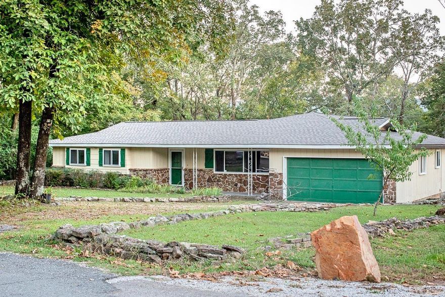 Charming 4-bedroom, 2-bath home with 1,949 sq ft just a short walk from the Historic Square in Mountain View. This 0.43-acre shaded lot offers mature trees and a fenced garden area, giving you an in-town location with a peaceful feel.  Inside, the home features an updated kitchen with concrete countertops, stainless appliances, a farmhouse sink, glass mosaic backsplash, and plenty of storage. The spacious dining room with French doors and board-and-batten accents connects nicely to the bright sunroom. You’ll also find a large laundry room and an oversized pantry—great for staying organized.  The entry mudroom bench and kitchen/dining flooring were featured in The Home Depot Blog, adding a fun touch of recognition. Living areas and bedrooms have recently cleaned carpet, and both bathrooms include board-and-batten detailing.  The 2-car garage offers a workbench, built-ins, and extra storage. The roof was replaced with architectural shingles in October 2023. The home has central heat and air, plus two wall-mounted propane heaters for backup. City water and garbage service are in place.