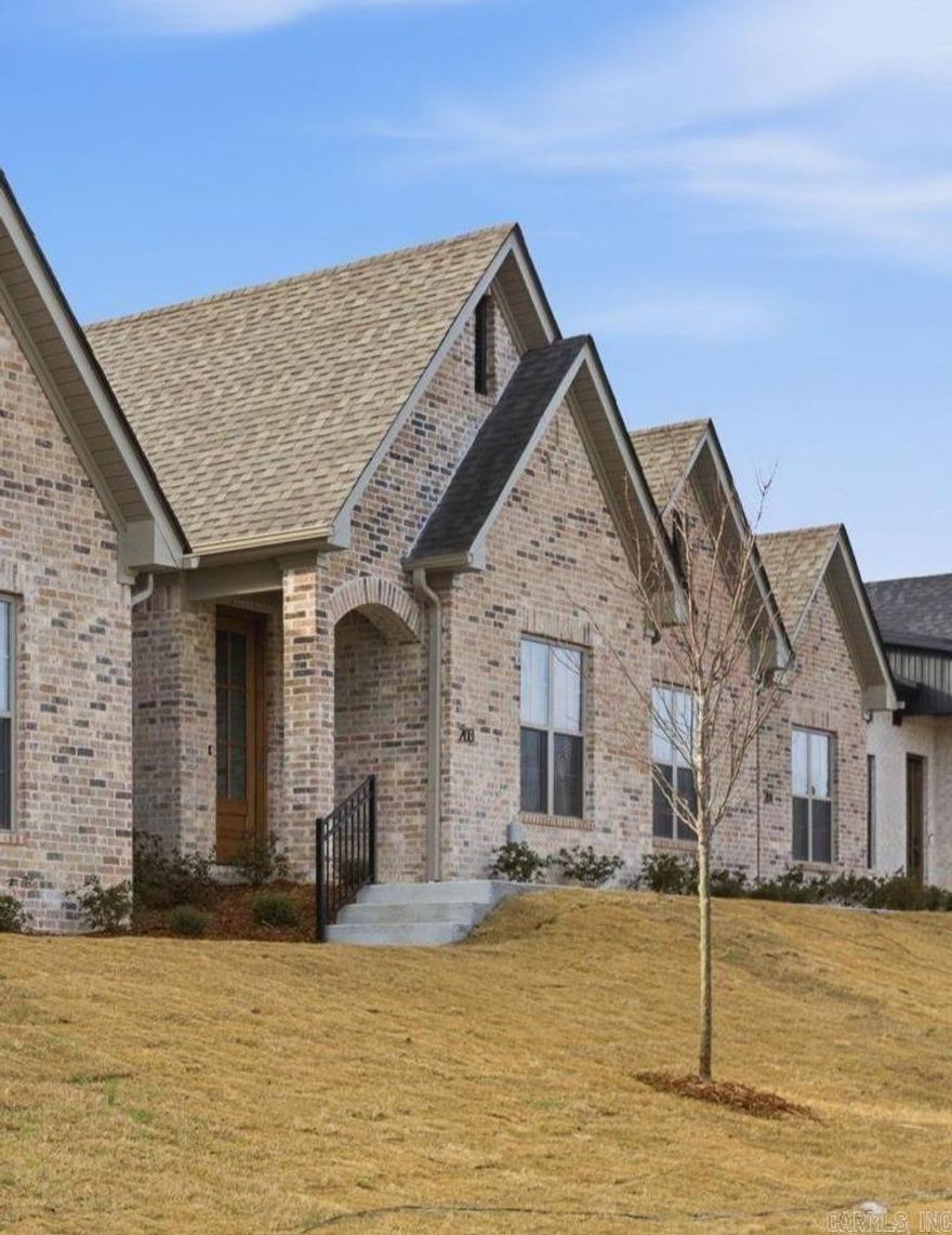 Welcome home to West Little Rock's latest destination for luxury living, Edgewood! NEVER MOW YOUR LAWN AGAIN! Lawn maintenance is included with your yearly fees! This unit has 2 bedrooms, 2 full bathrooms. Fully loaded chef's kitchen includes walk-in pantry, central island and opens to spacious living room with built in fireplace. Master Suite includes high vaulted ceilings and the spa like bathroom which has a walk-in shower with walk-in closet. Laundry Room, Two Car Garage and covered back patio accessed off the private drive.