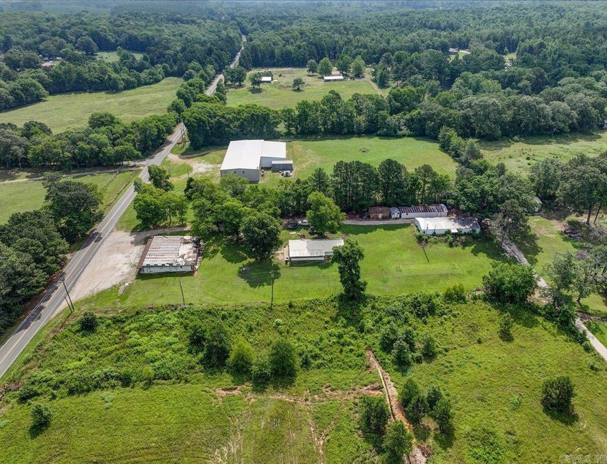 Charming old farmhouse with shops, storage buildings, and historic grocery store on 2 acres.  Step back in time with this unique and versatile property on 2 acres of countryside charm.  This classic home offers the perfect canvas for restoration or creative reinvention.  Adjacent to the house (1440 sf), you will find two sizable shops (shop 1=1960 sf and shop 2= 1440 sf) ideal for wood working, automotive work, or small business operations.  Additional storage buildings offer ample storage for equipment and tools.  Adding even more potential, the property includes an old historic grocery store building that could be restored as a retail space, studio, or unique venue.  This property offers a rare opportunity for homesteading, small business ventures, or quiet country retreat.  Addresses are 3669, 3671, and 3673 Amity Rd.